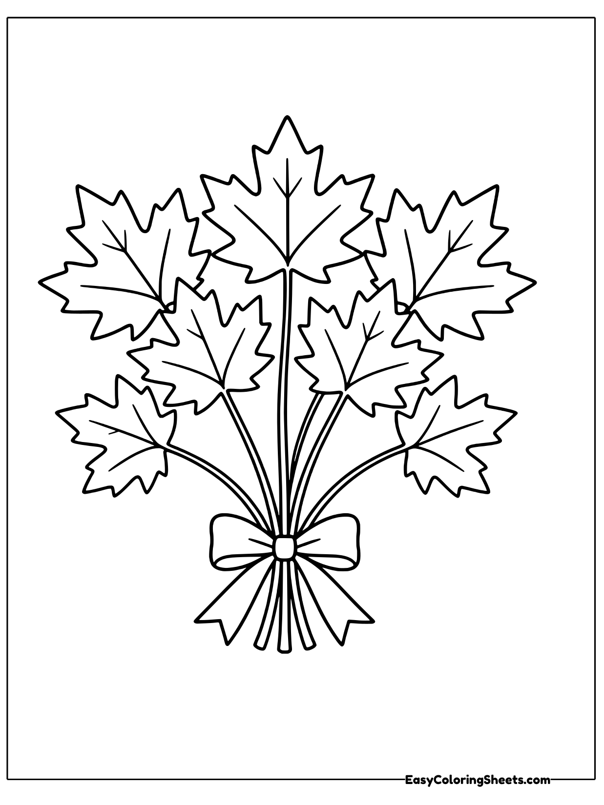 A bunch of maple leaves on long stems is gathered into a bouquet and tied with a ribbon bow.