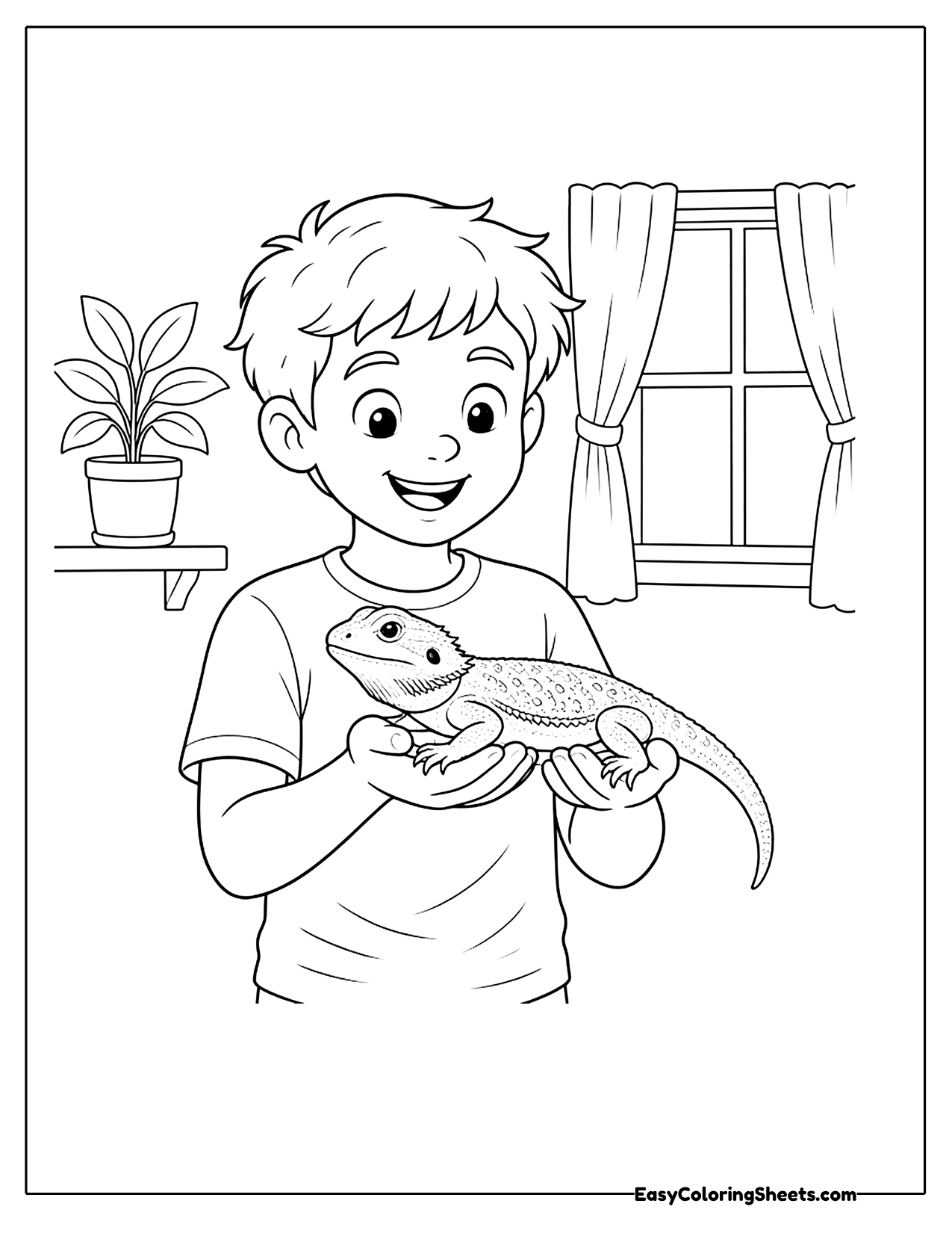 Boy holding a bearded dragon