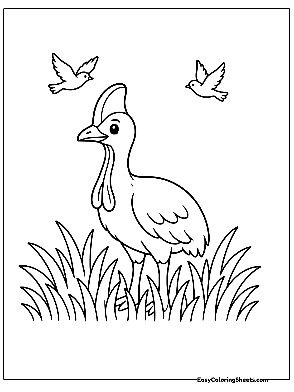 A cassowary strides through tall grass while two small birds fly overhead.