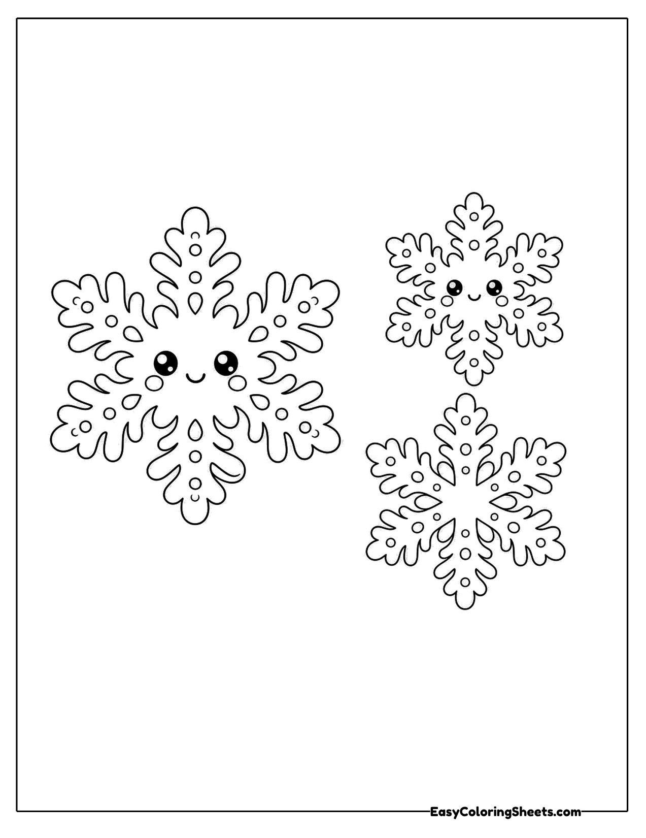 Three lacy snowflakes, two with smiling faces