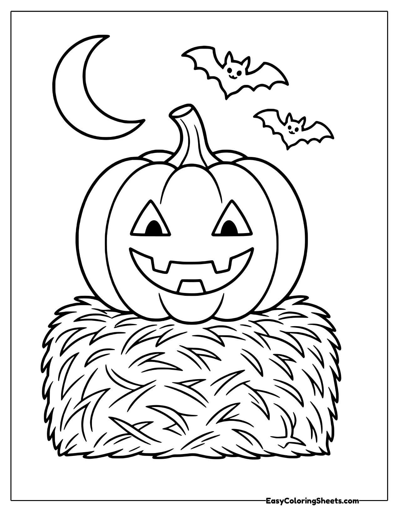 Jack-o-lantern grinning on a hay bale