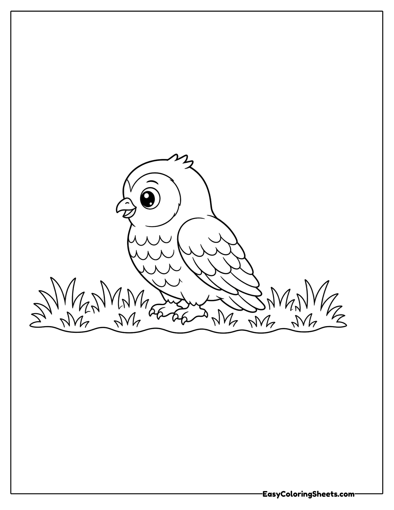 A small owl sits among tufts of grass in side view.