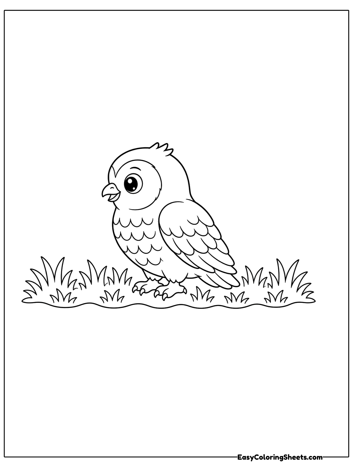 A small owl sits among tufts of grass in side view.