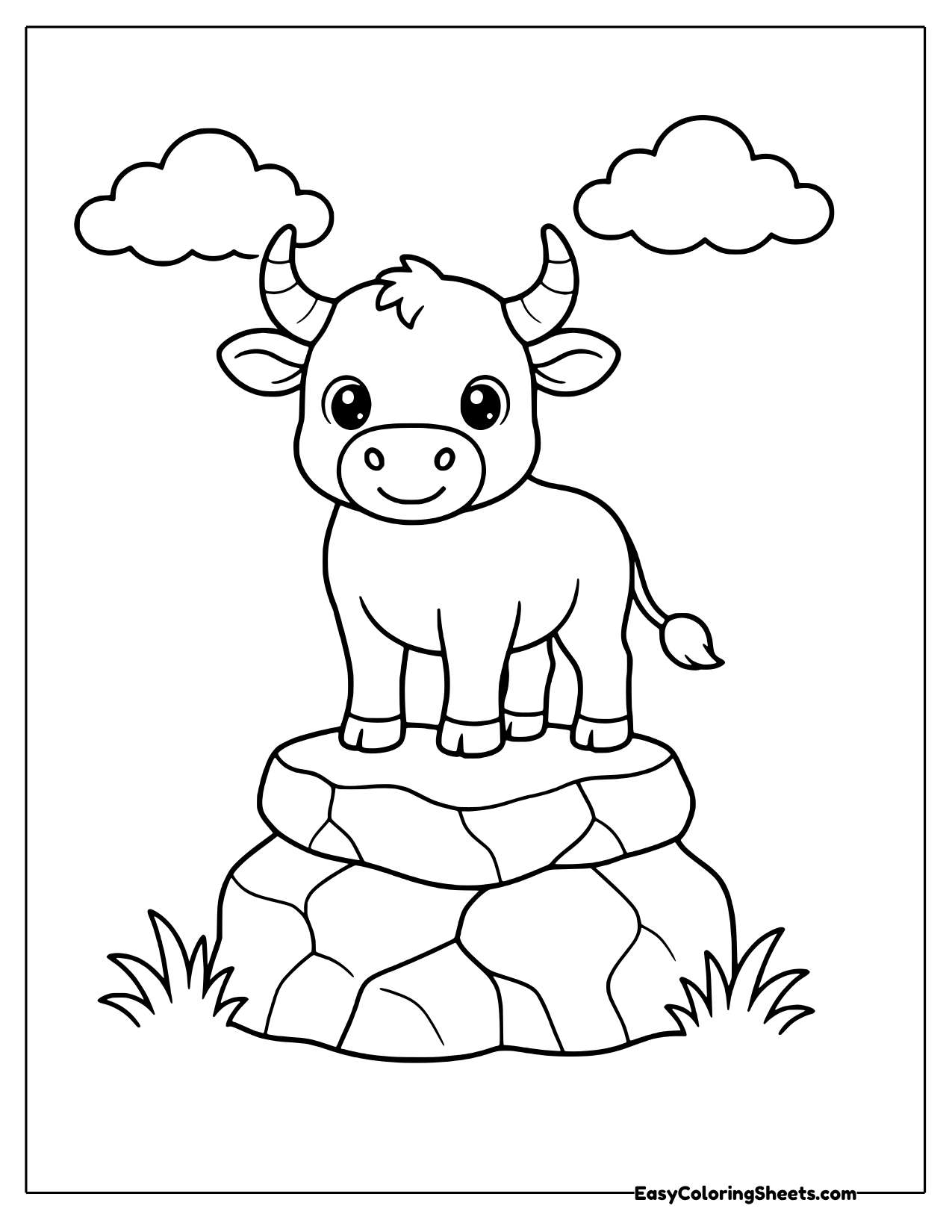 Bull on top of a pile of rocks