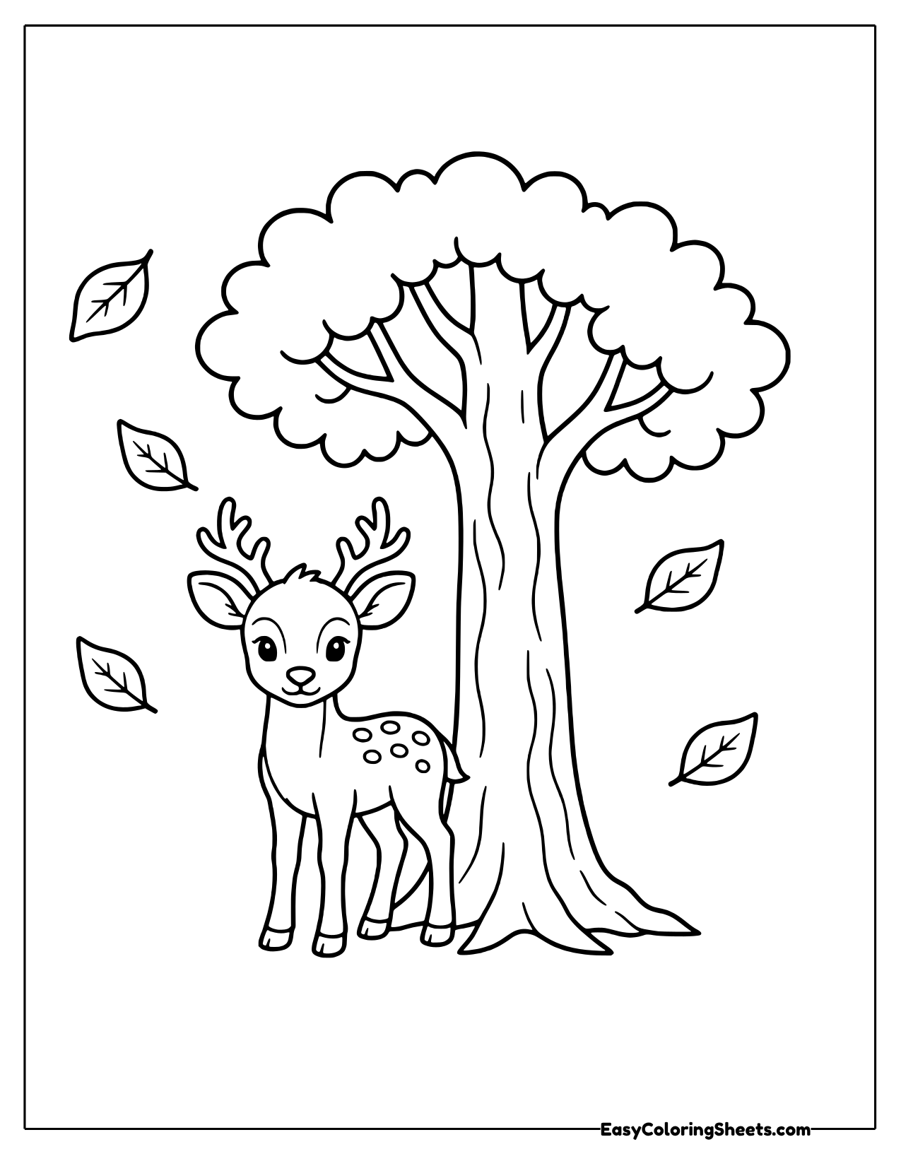 Spotted fawn standing beneath a leafy tree with falling leaves