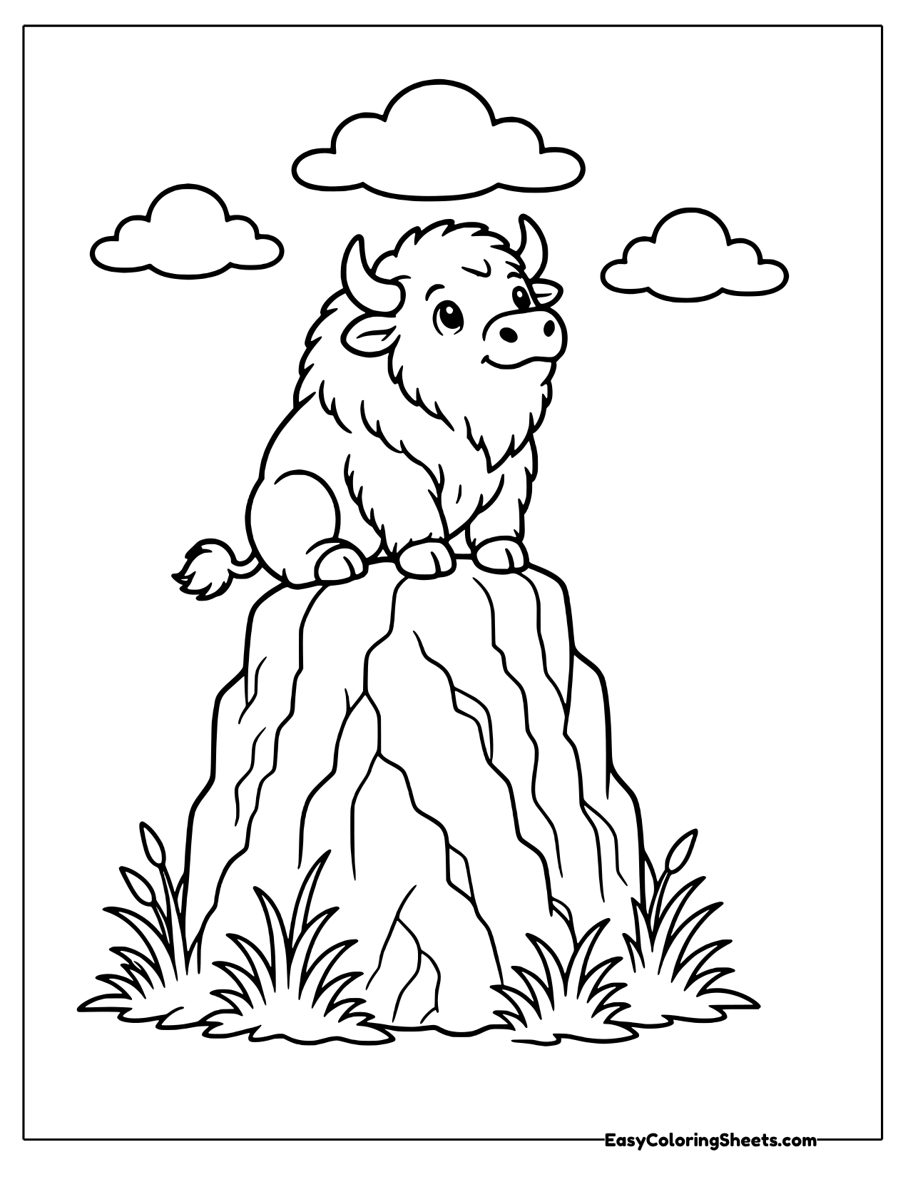 Bison standing on a rocky ridge
