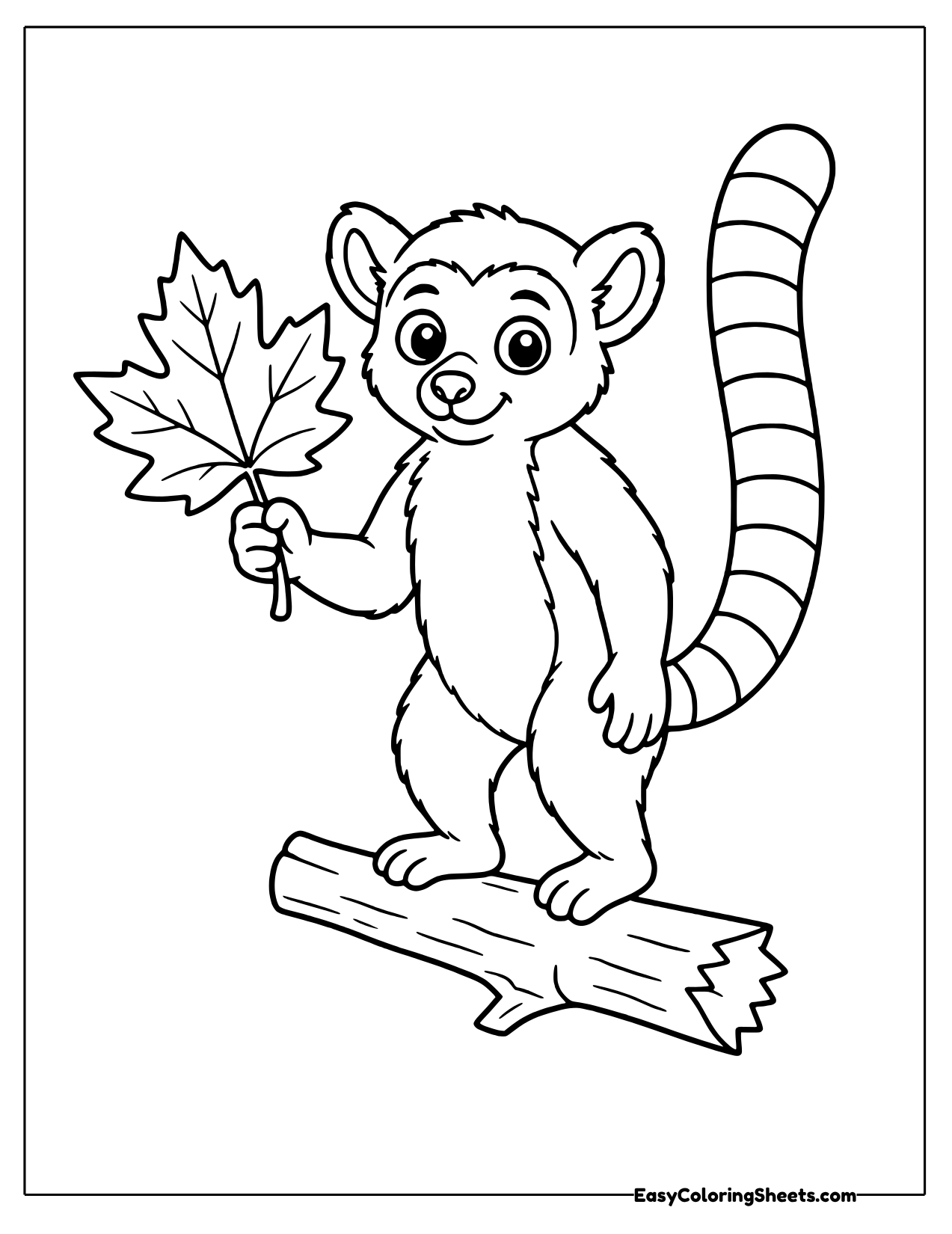 Lemur holding a maple leaf on a log