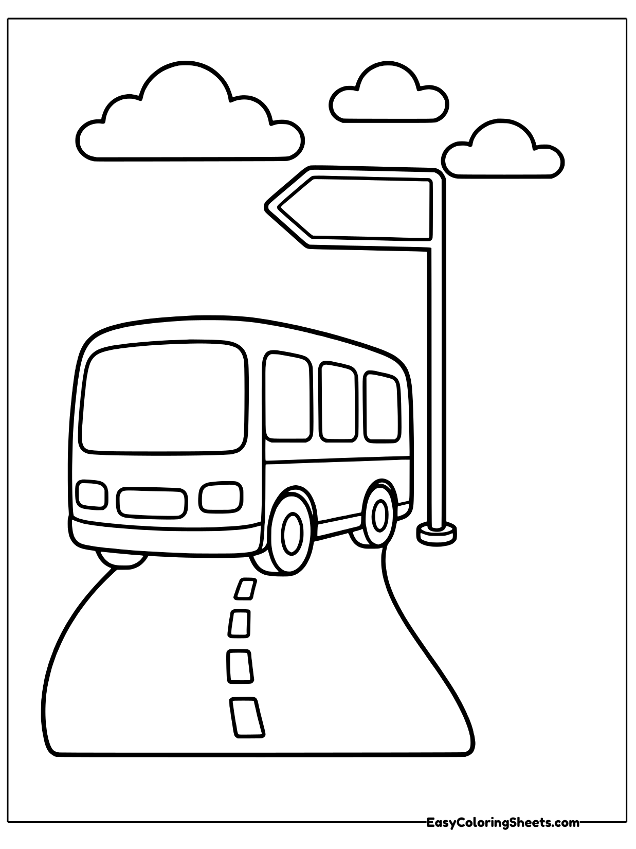 A bus drives along a curved road beside a tall signpost pointing the way, with clouds in the sky.