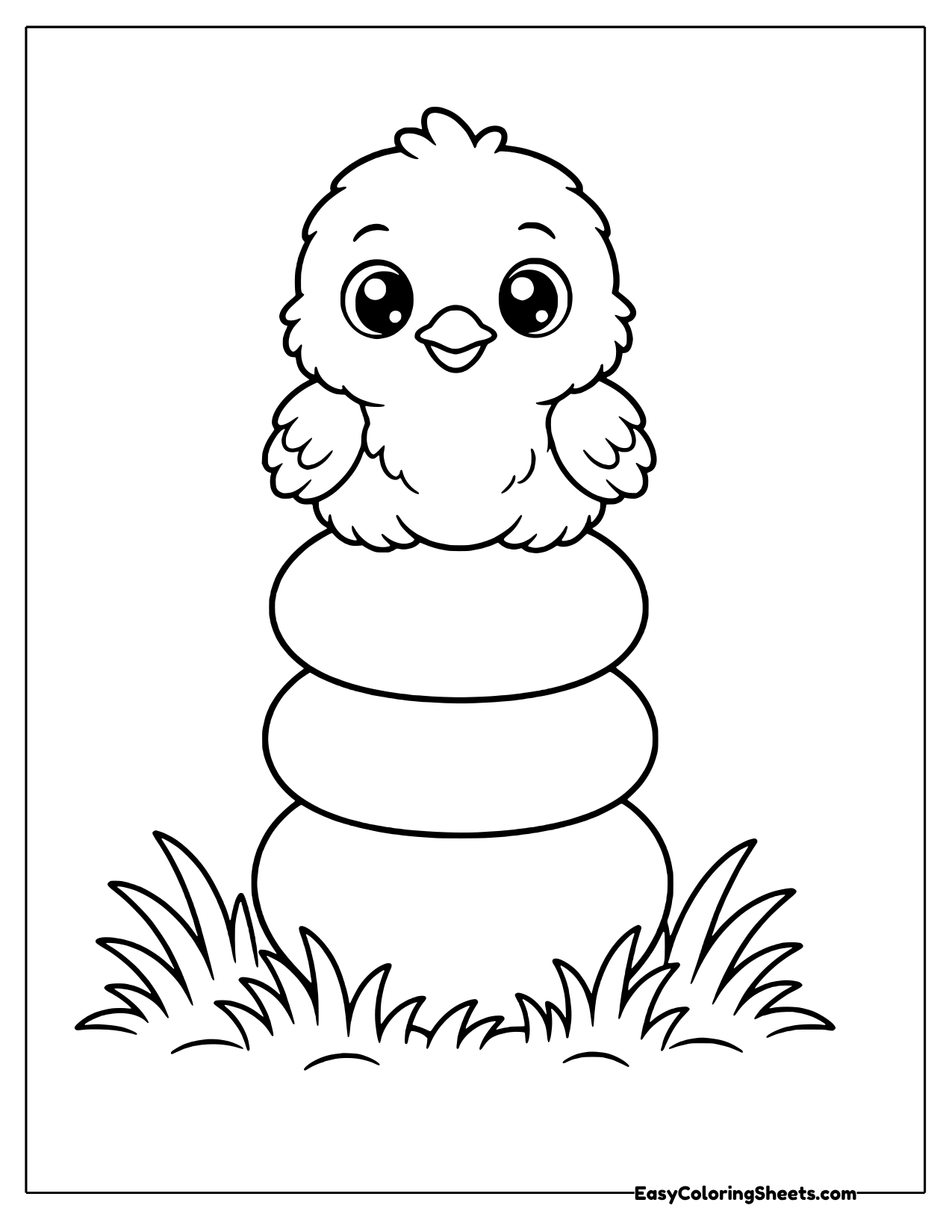A fluffy chick sits on a tall stack of rounded rings that narrow toward the top, with grass at the bottom.
