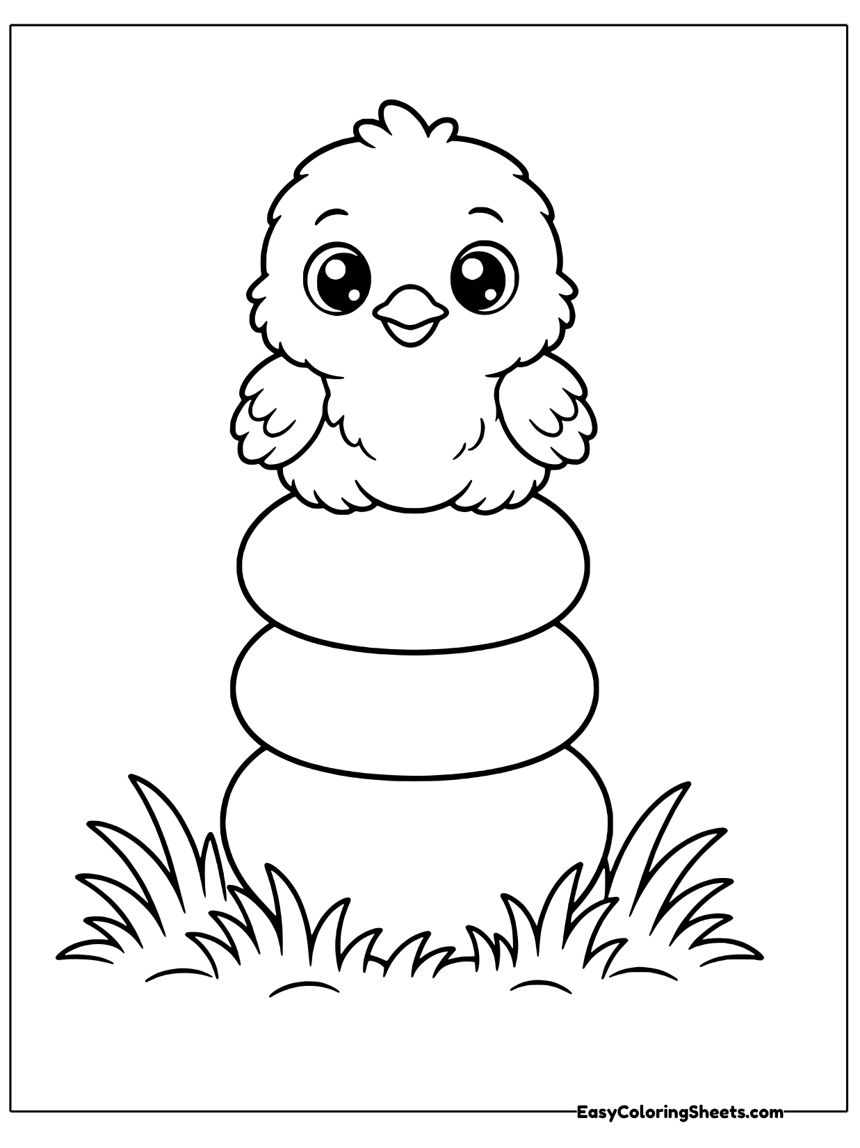 A fluffy chick sits on a tall stack of rounded rings that narrow toward the top, with grass at the bottom.