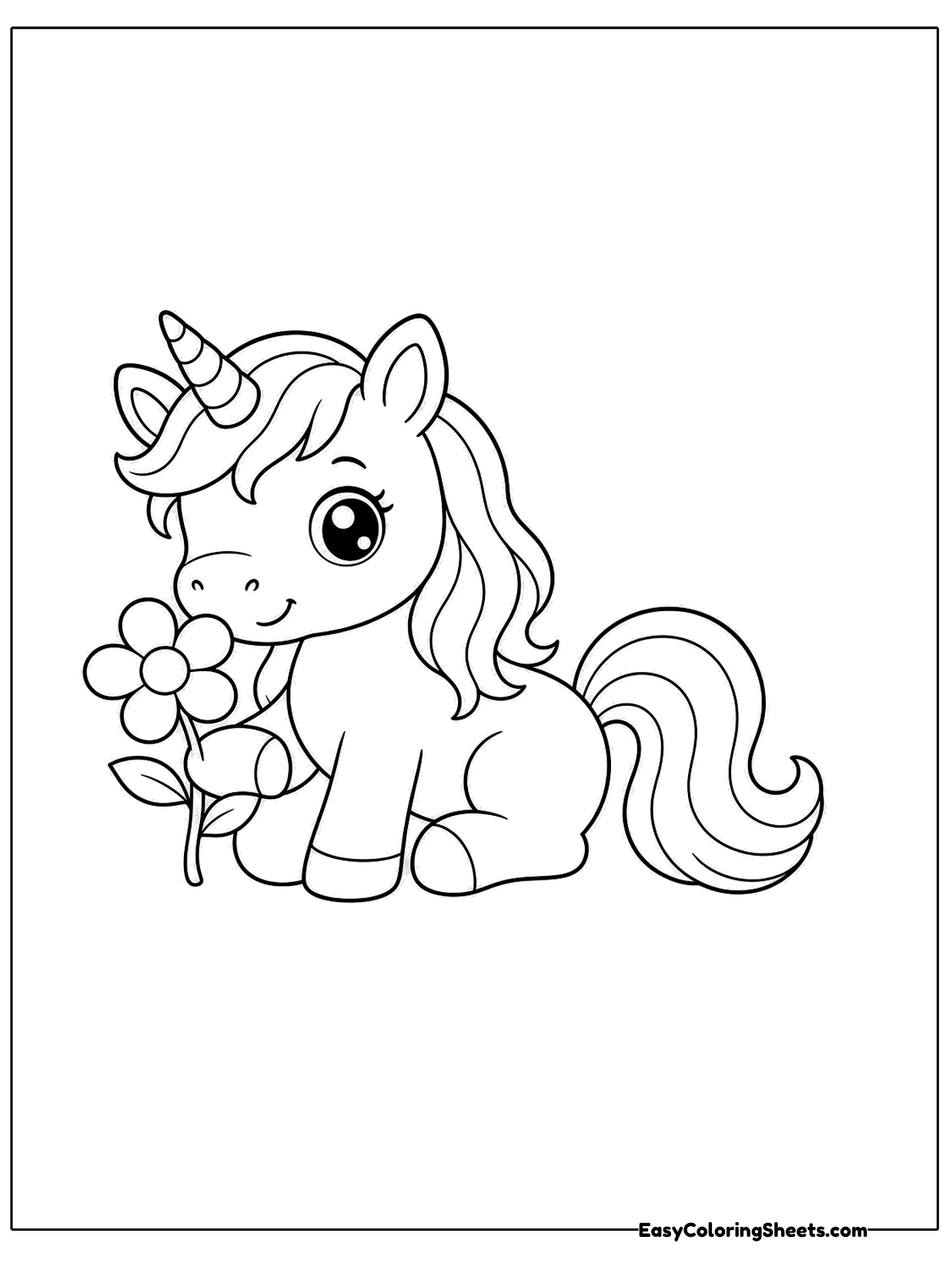 A unicorn lies down beside a single flower, looking at it with a gentle smile.