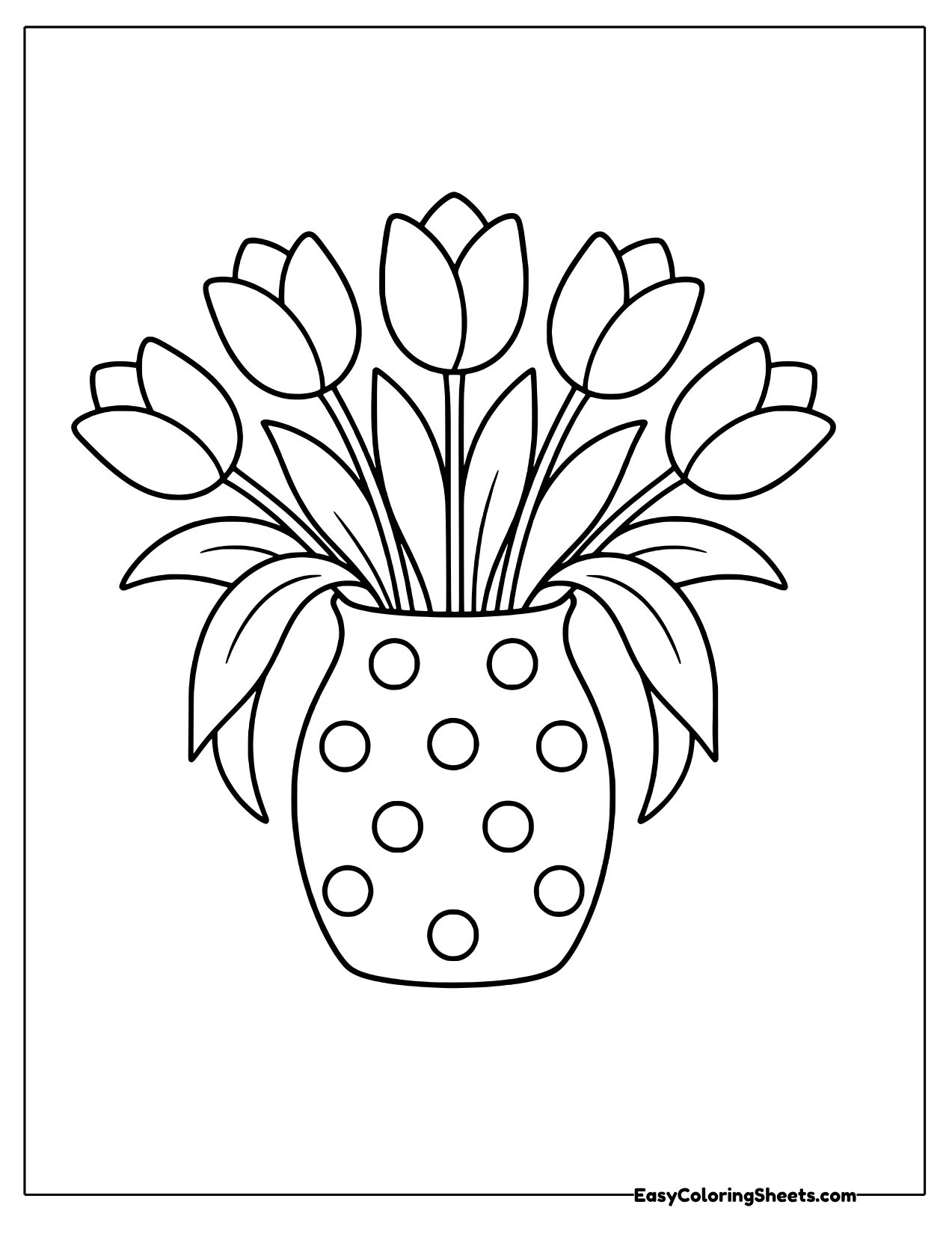 Bunch of tulips in a polka dot vase