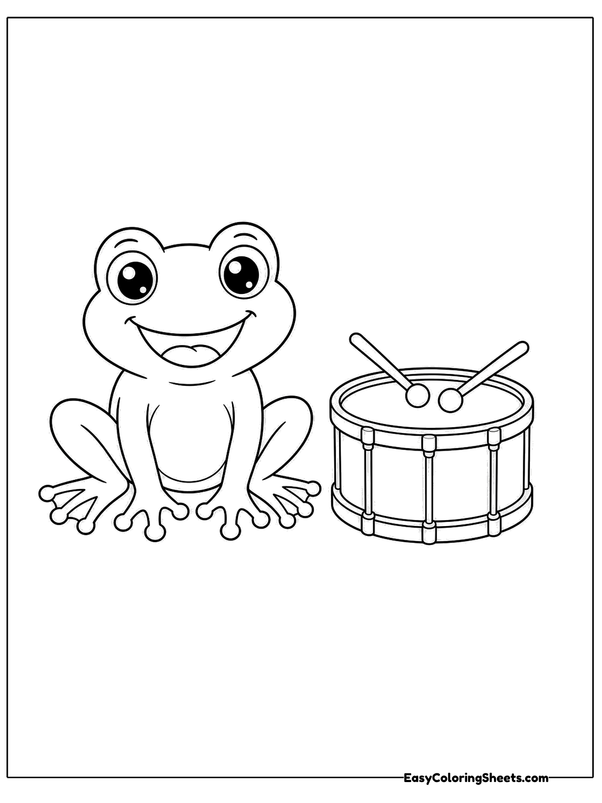 A happy frog sits beside a small marching drum with crossing sticks resting on top.