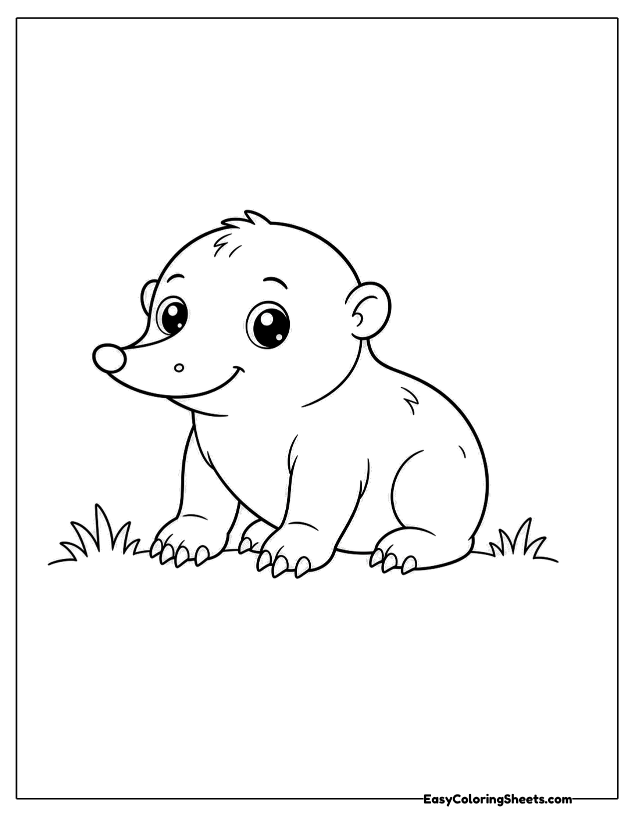 Baby mole sitting on a patch of grass