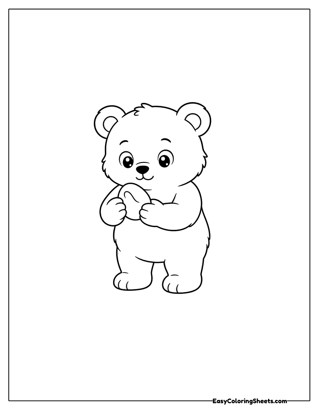 Little bear holding a small stone