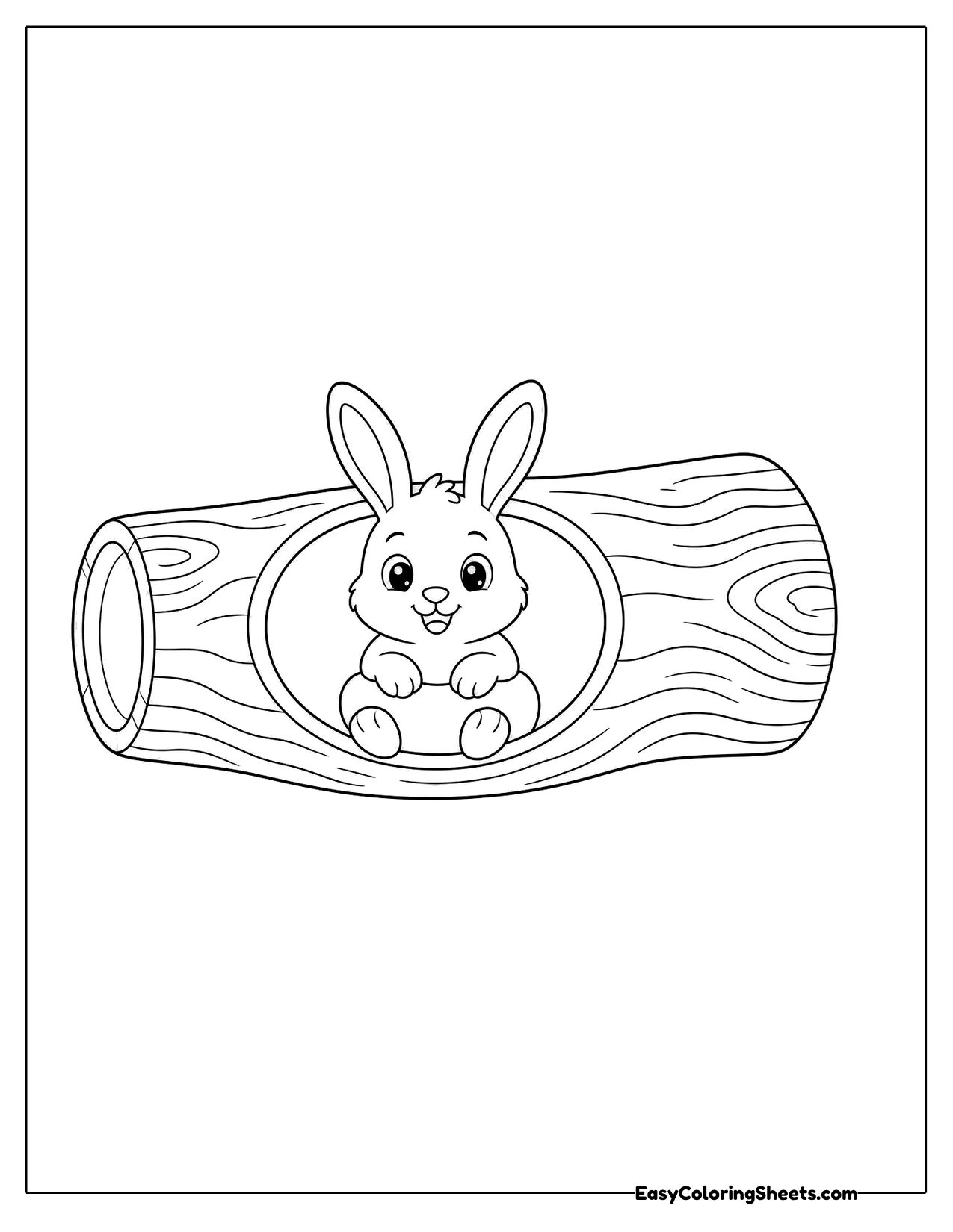 Bunny sitting inside a hollow log with only its front showing