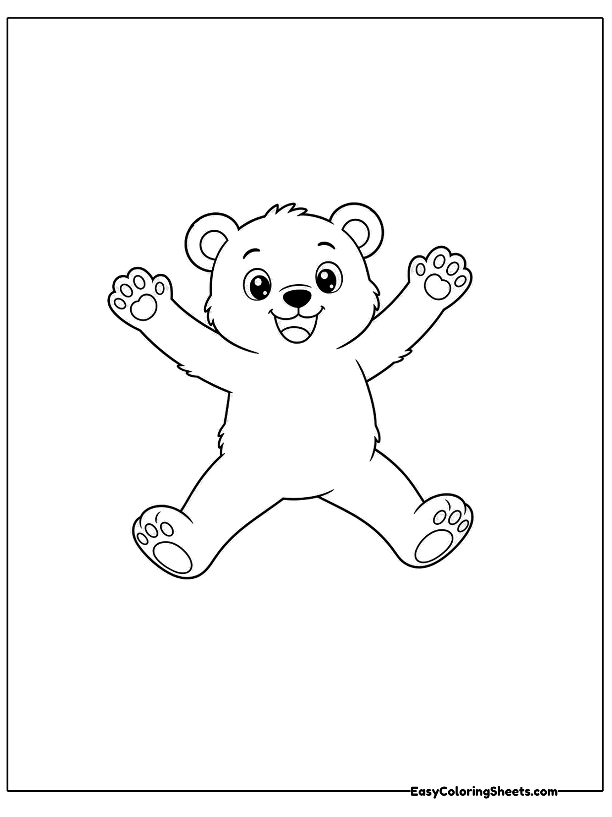 A bear cub jumps for joy with its arms and legs spread wide like a star.