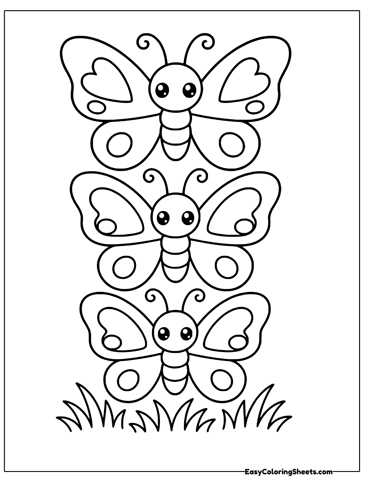 Three butterflies stack in a neat tower over a row of grass, each with heart shapes on its wings.