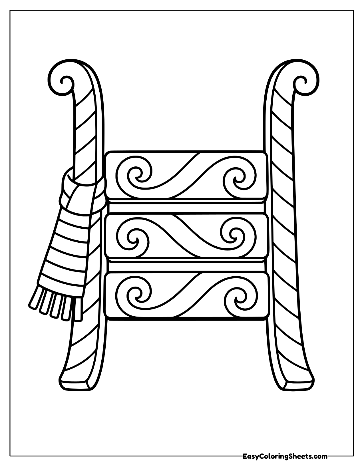 Upright sled with peppermint swirls and a striped scarf