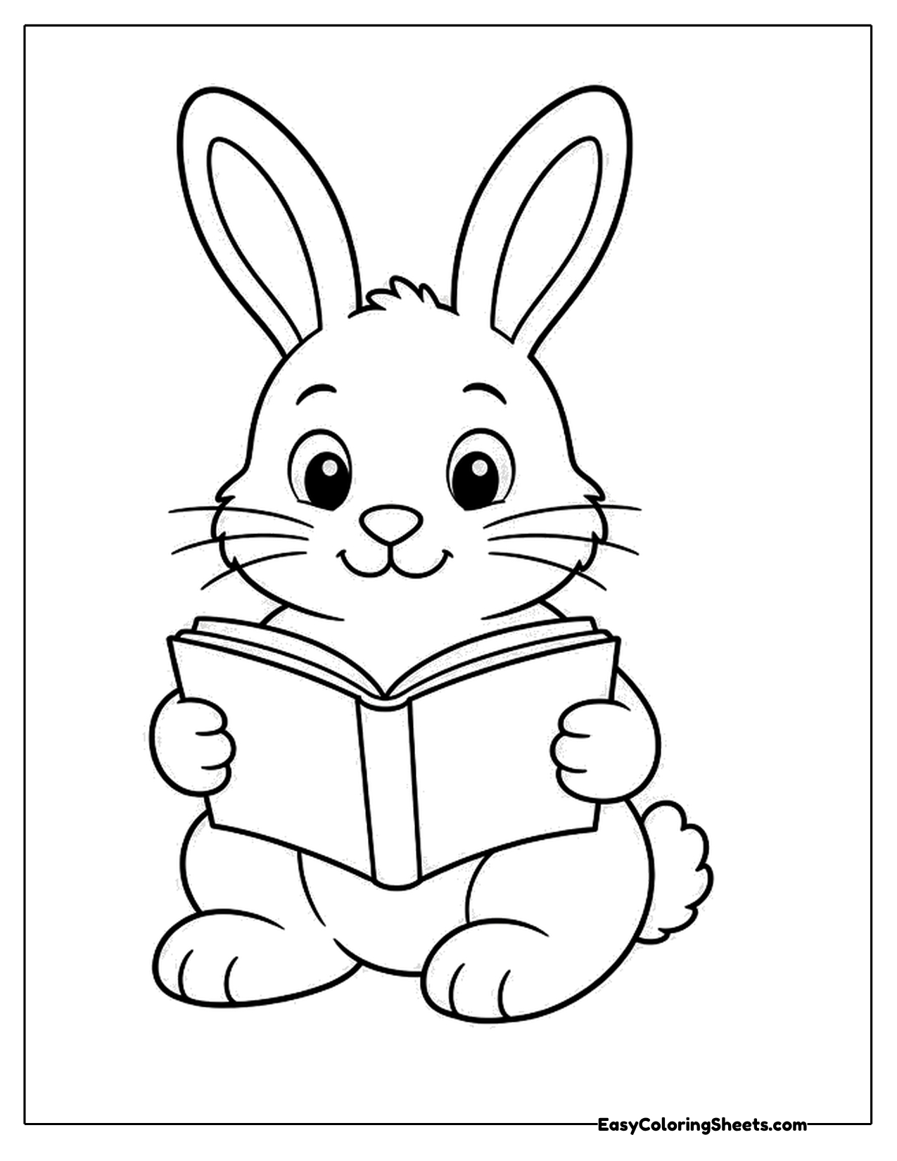 Bunny holding an open book and reading
