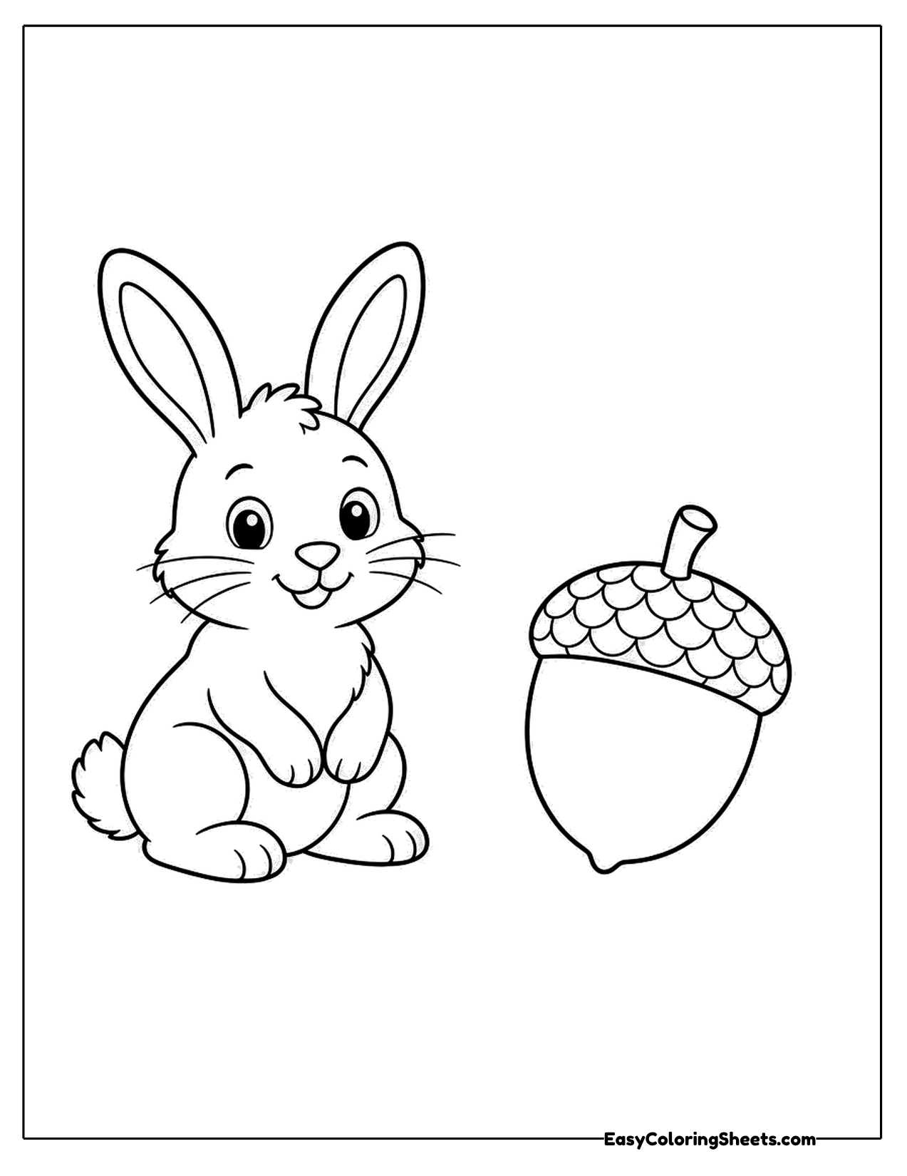 Rabbit sitting beside a large acorn