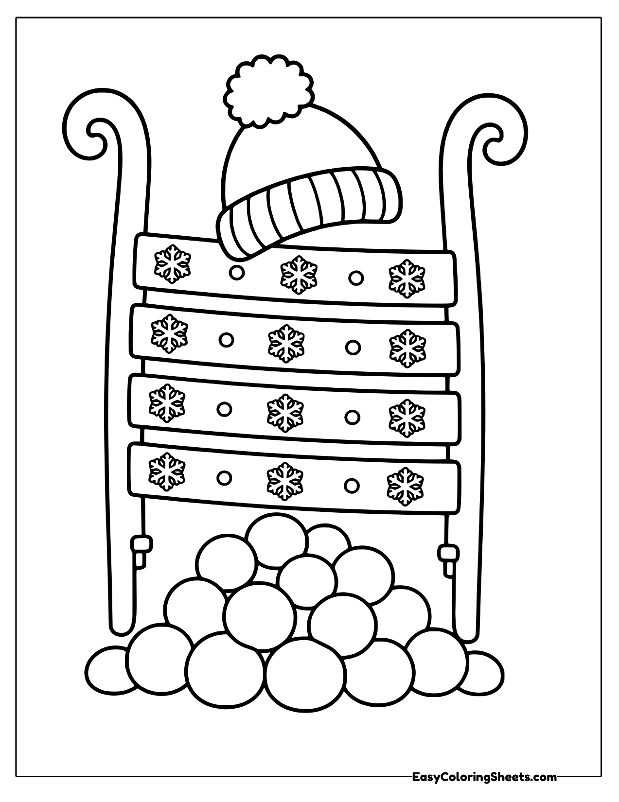 Upright sled with a knit hat and a pile of snowballs