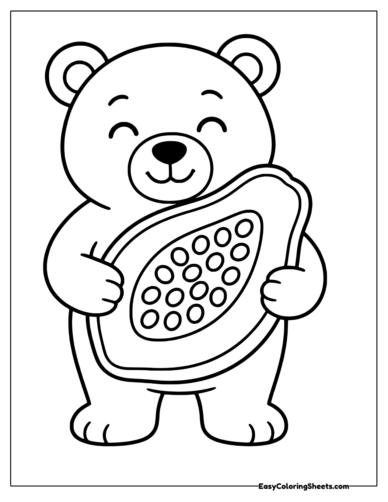 Smiling bear holding a big papaya half with seeds