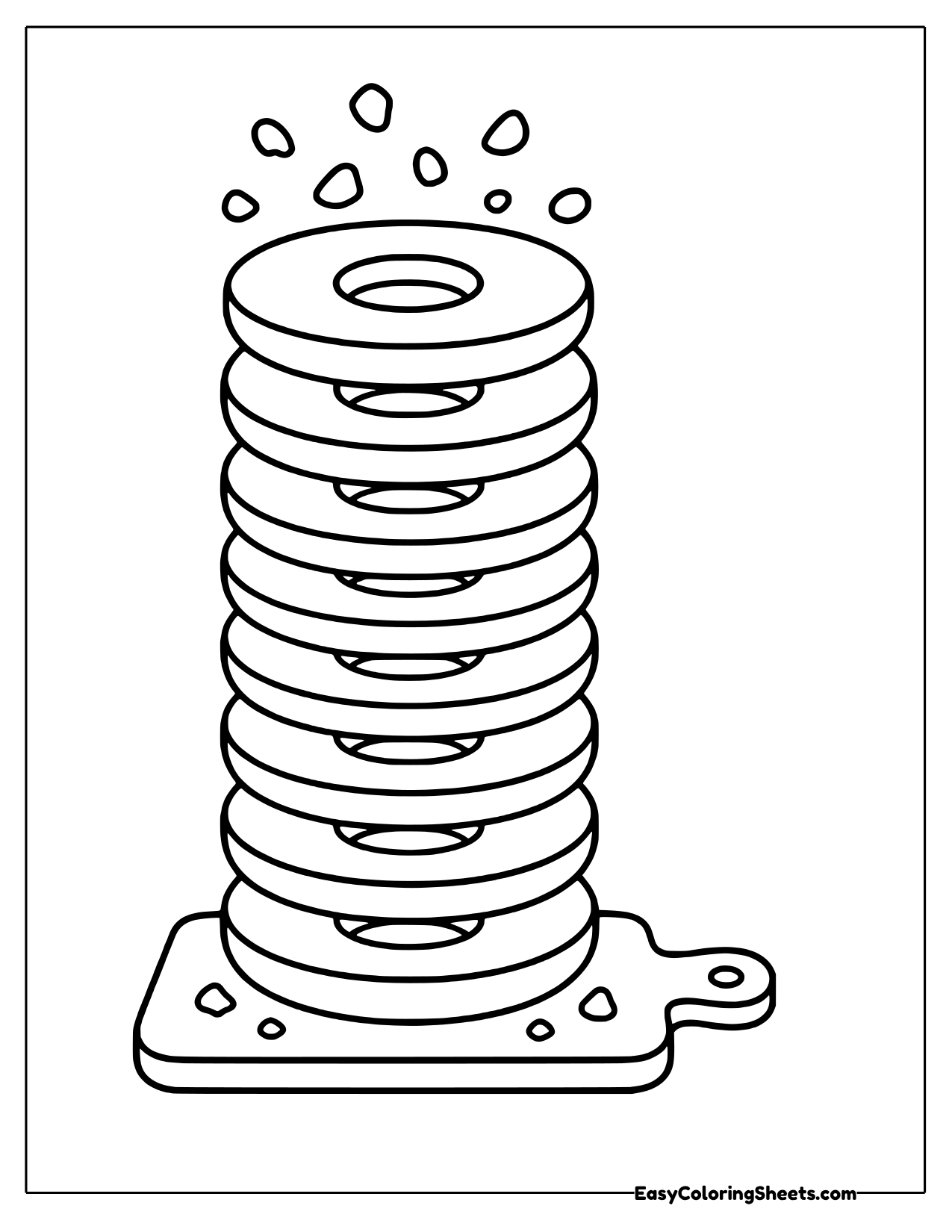 Tall stack of bagel halves on a cutting board