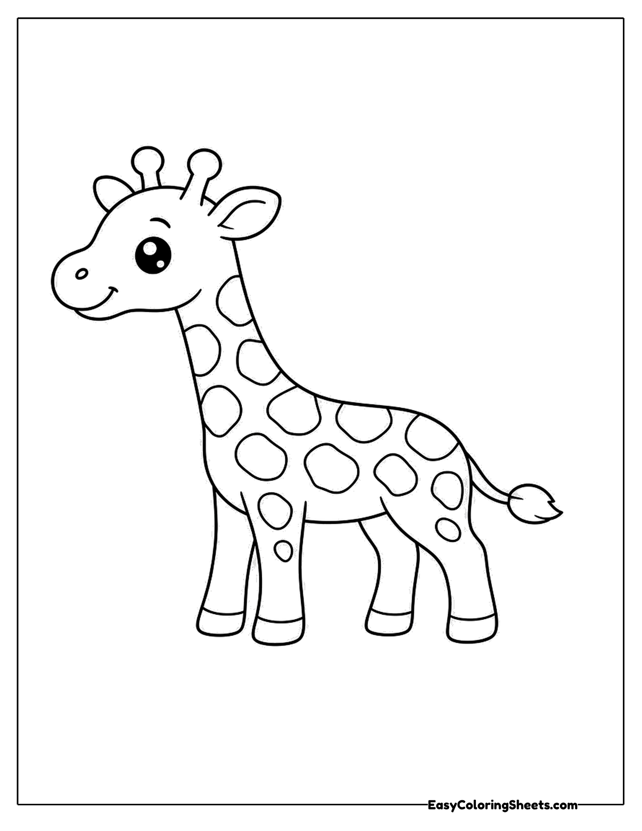 Small giraffe standing with a long spotted neck