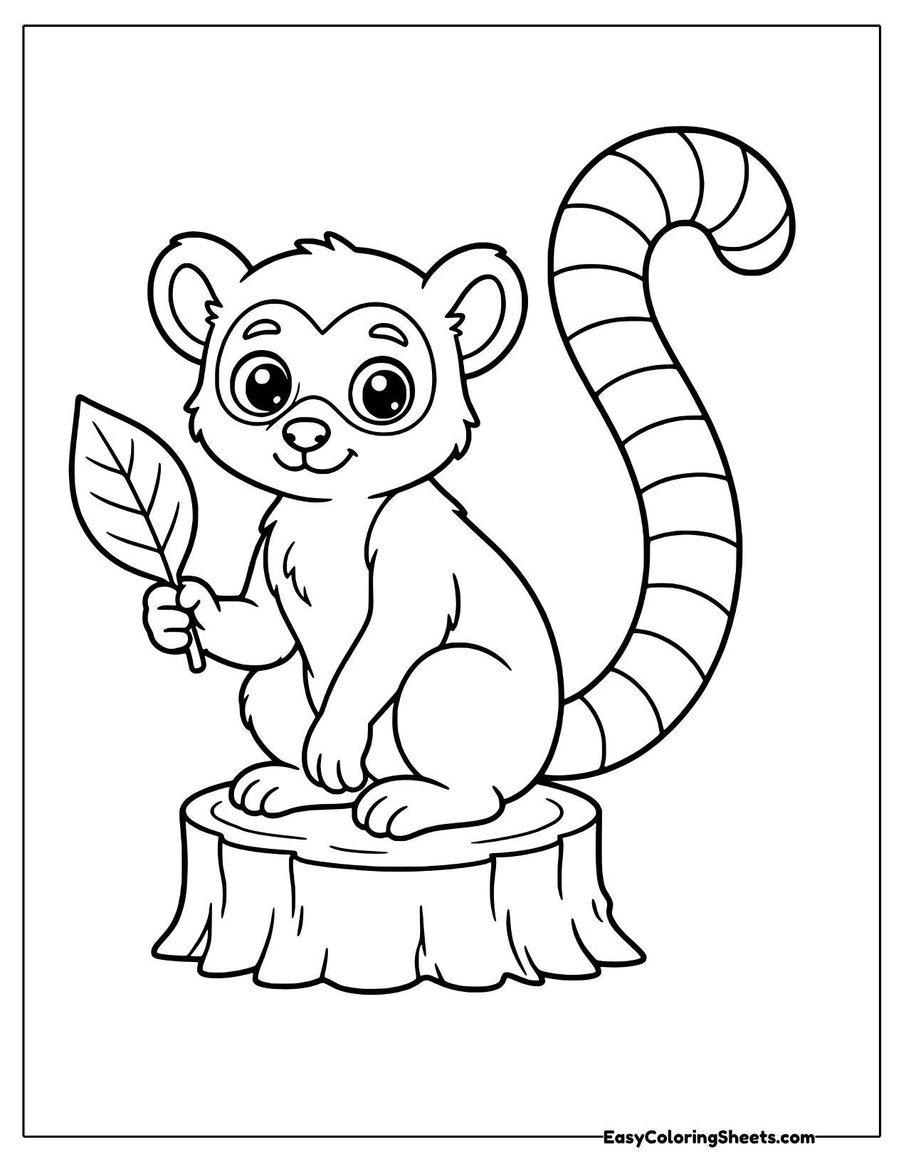 Lemur on a stump holding a leaf