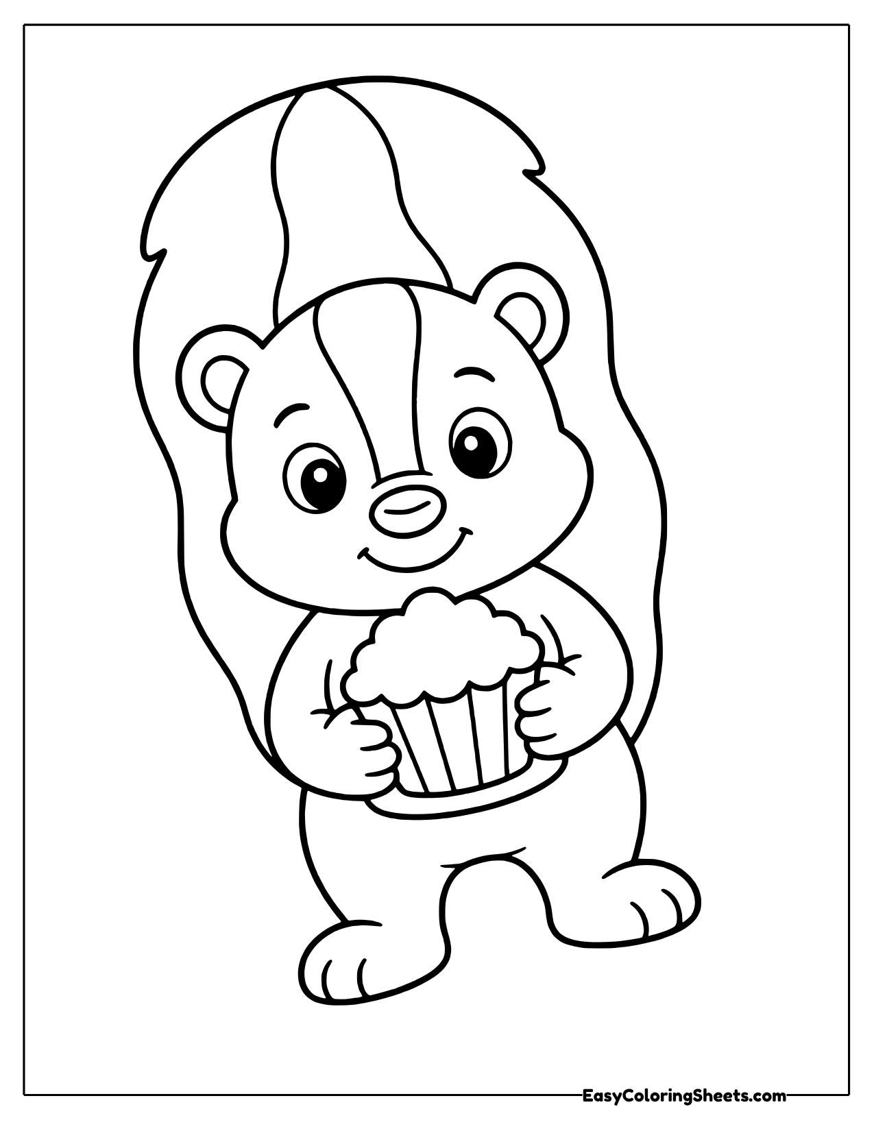 Sweet little skunk holding a frosted cupcake in both paws