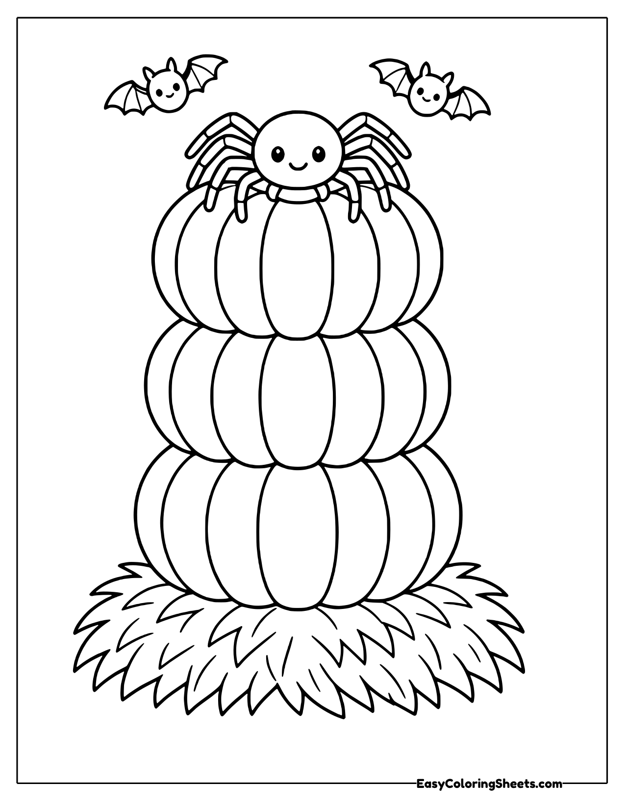 Spider on top of a stack of three pumpkins