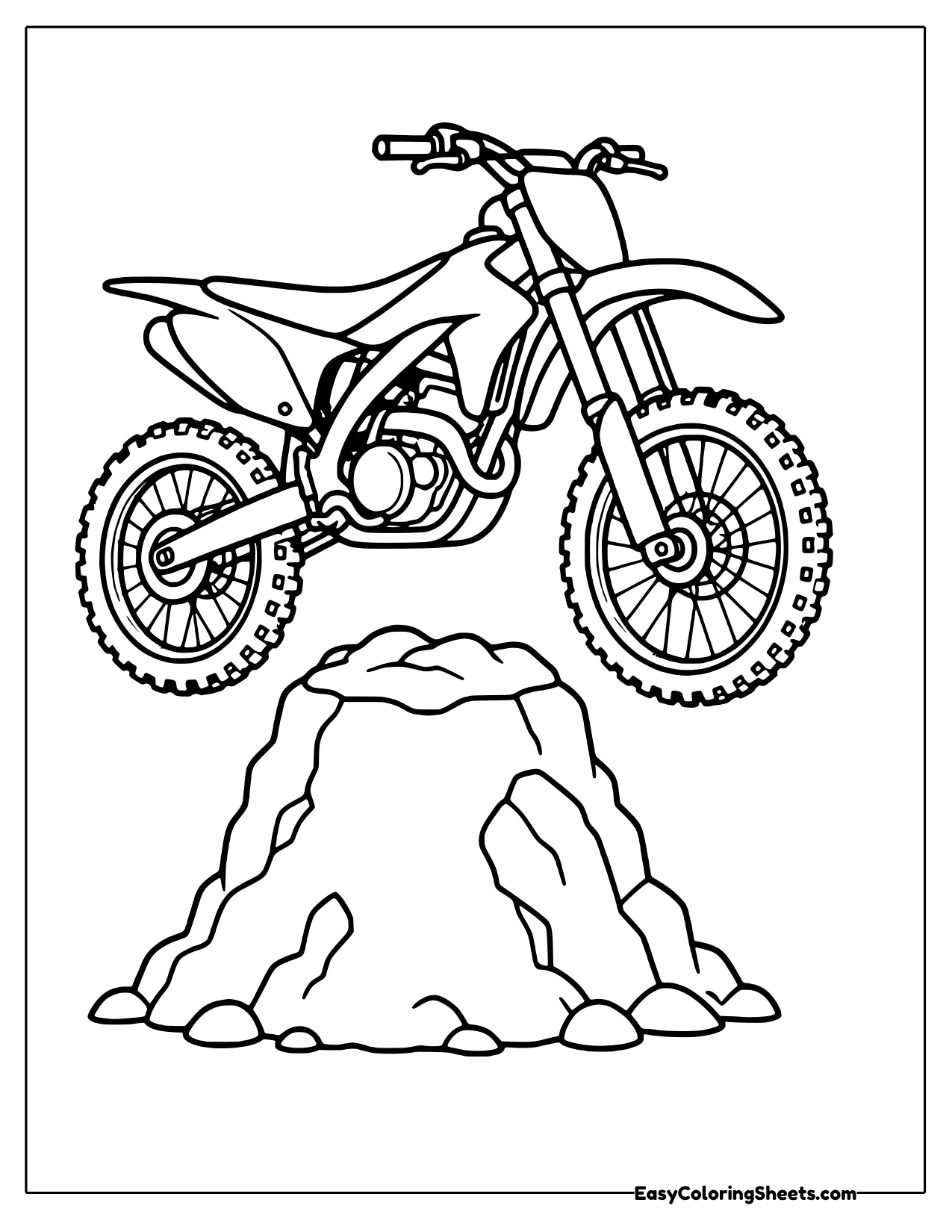 Dirt bike perched on a rock pile