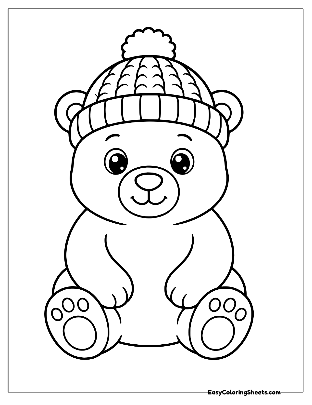 Polar bear cub in a pom pom hat