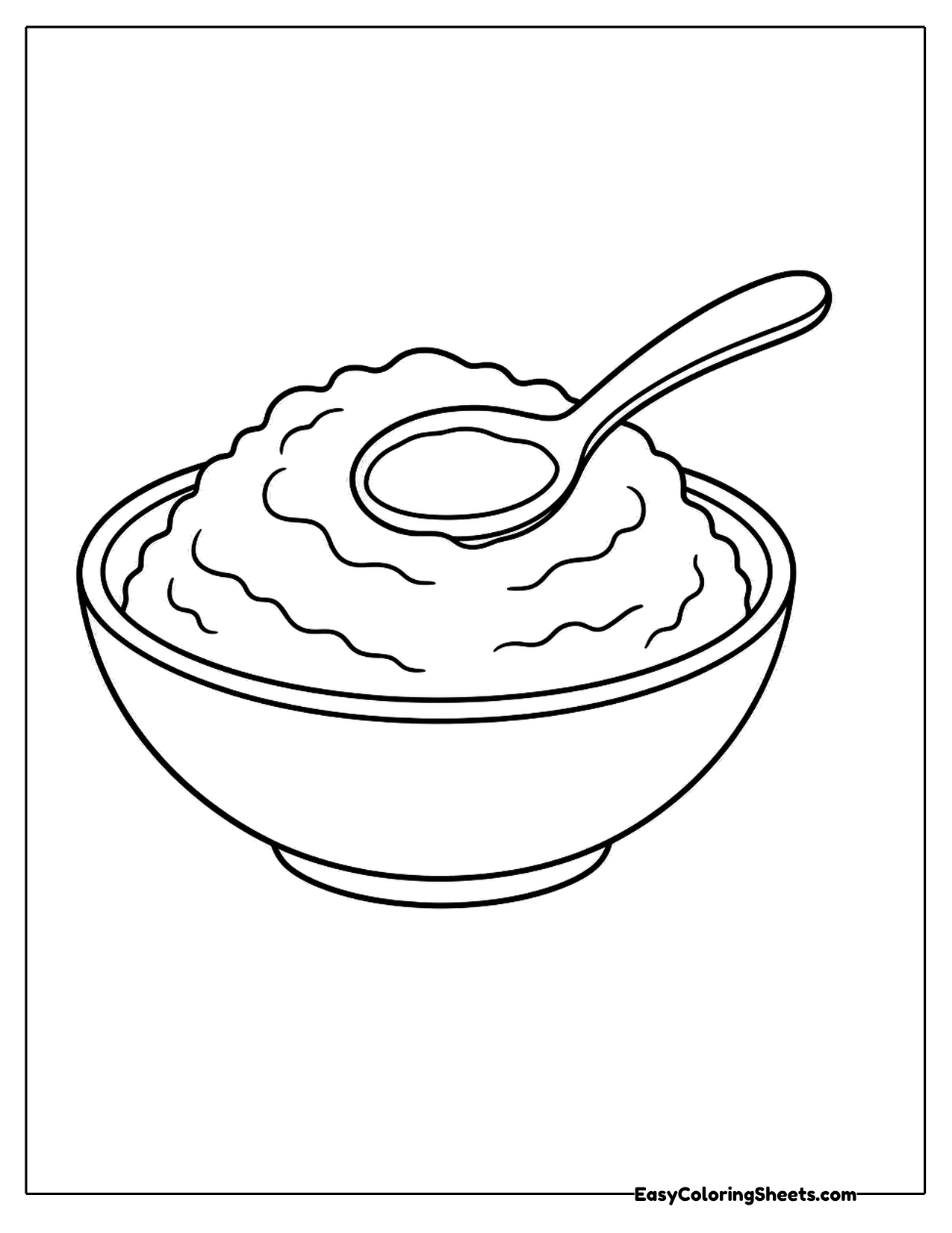 Bowl of fluffy mashed potatoes with a spoon