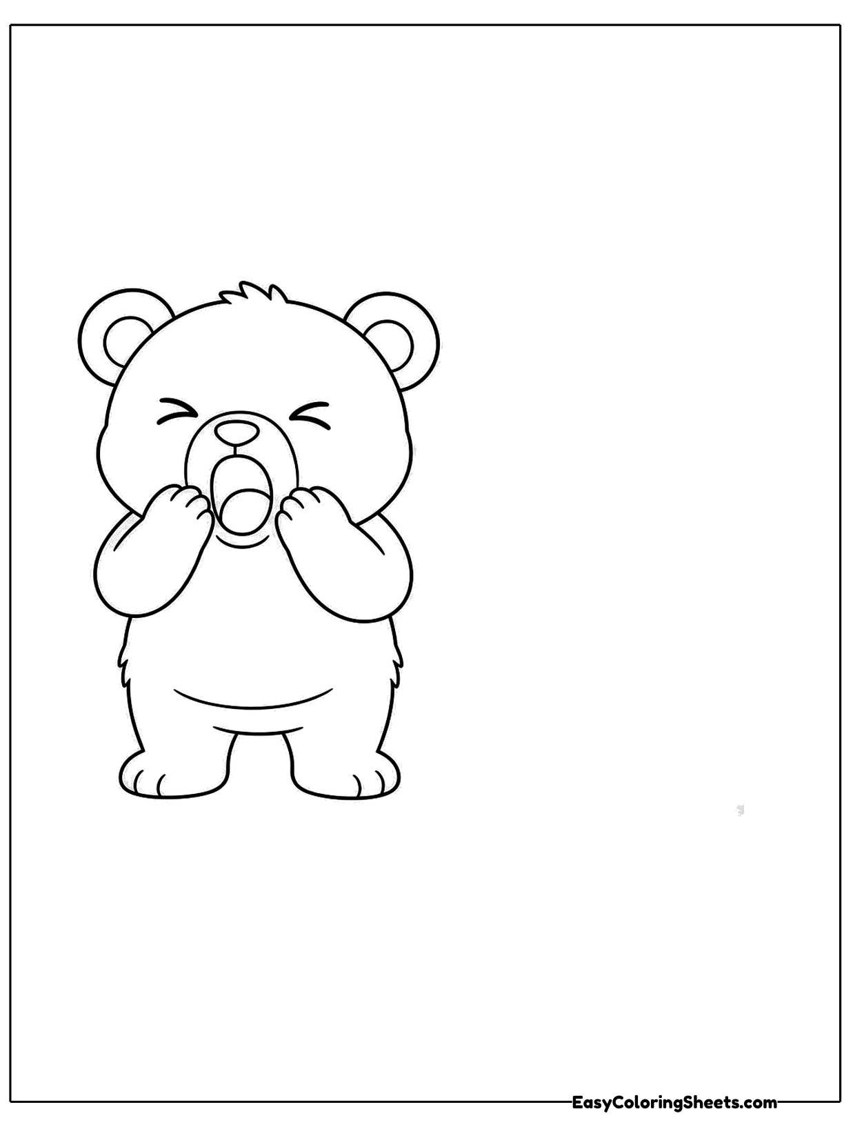 A bear cub yawns with its mouth wide open and paws raised near its face.