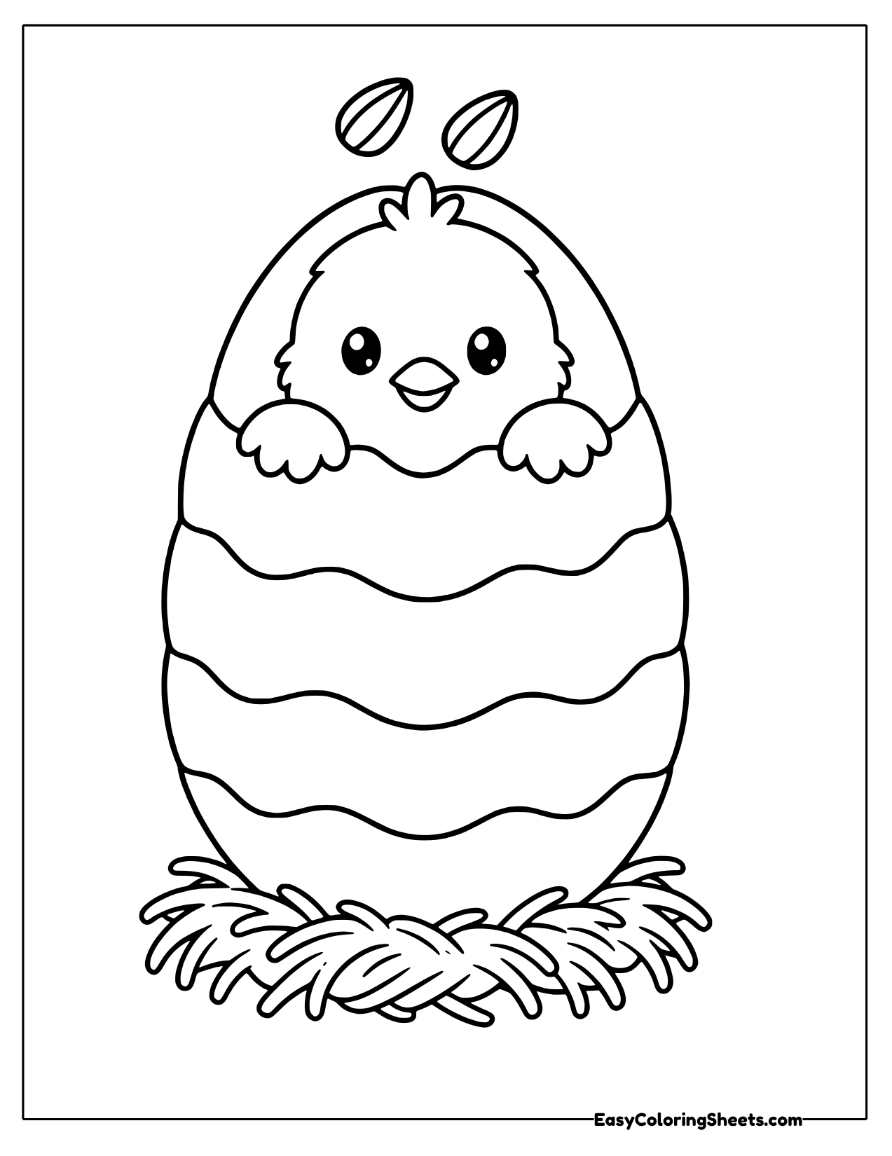 Chick peeking out of a decorated egg