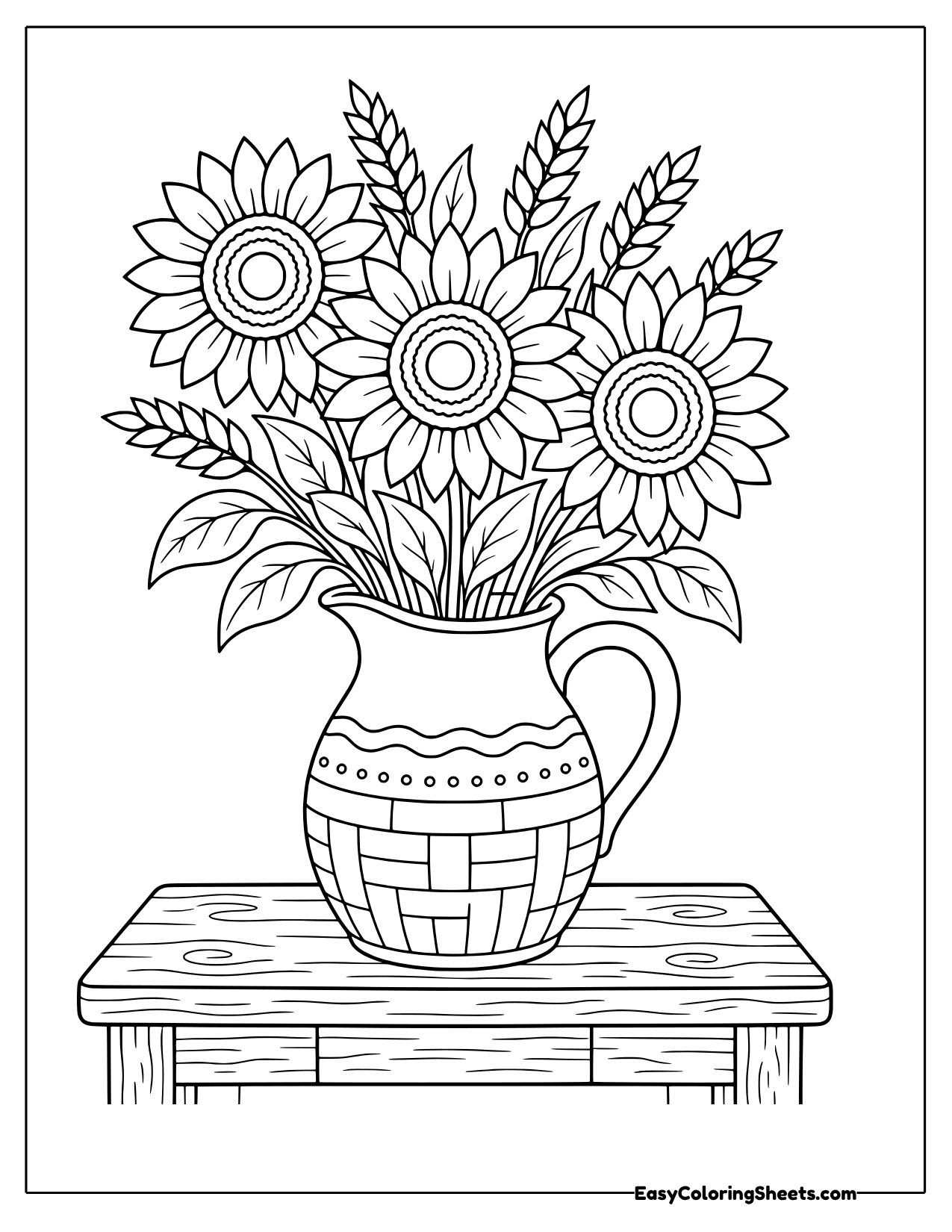 Sunflowers and wheat in a farmhouse jug on a table