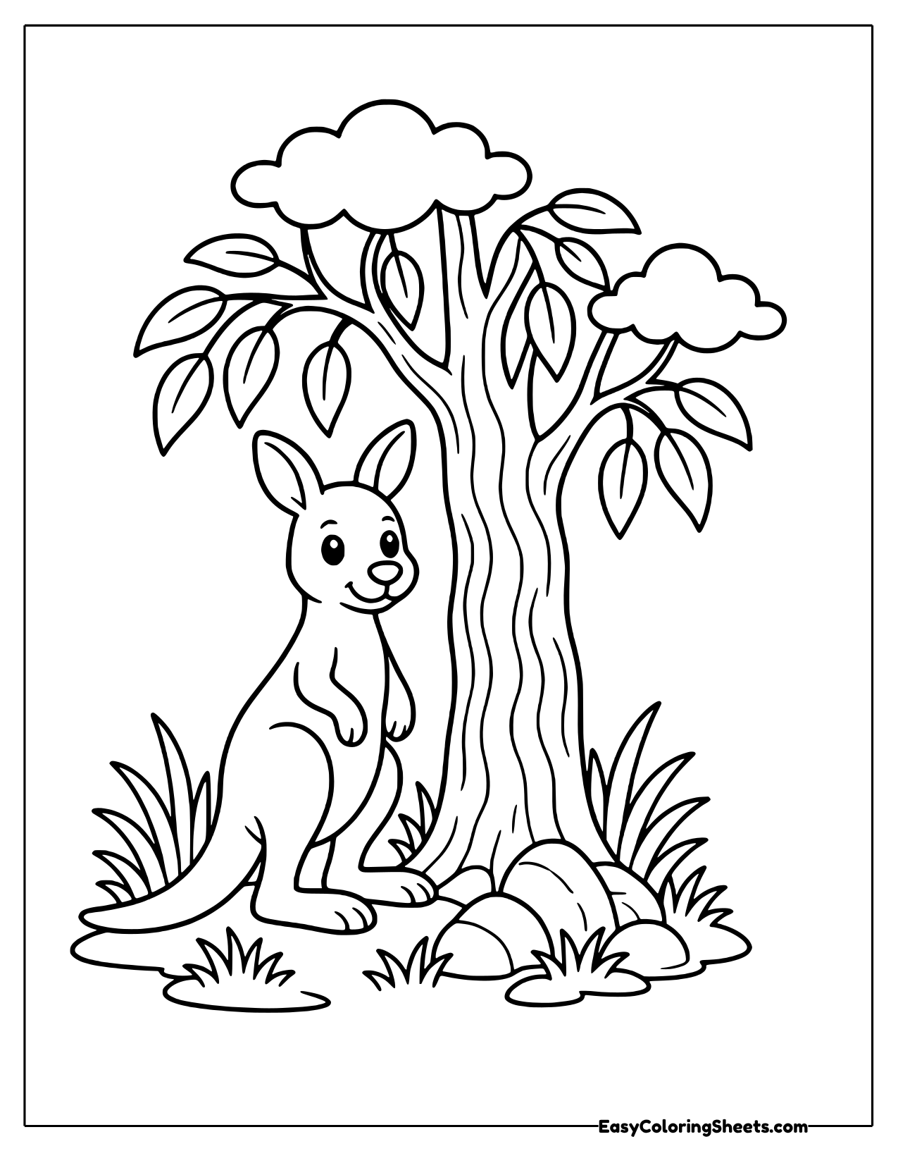 Kangaroo standing beside a tall eucalyptus tree