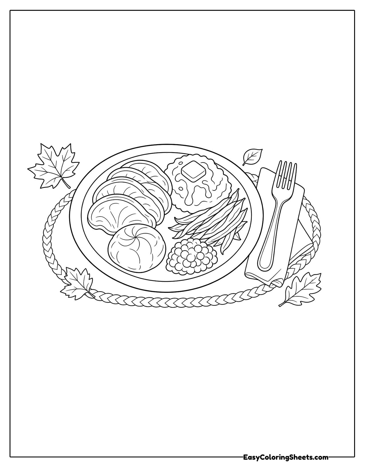 Dinner plate with turkey, vegetables and sides beside a fork and knife
