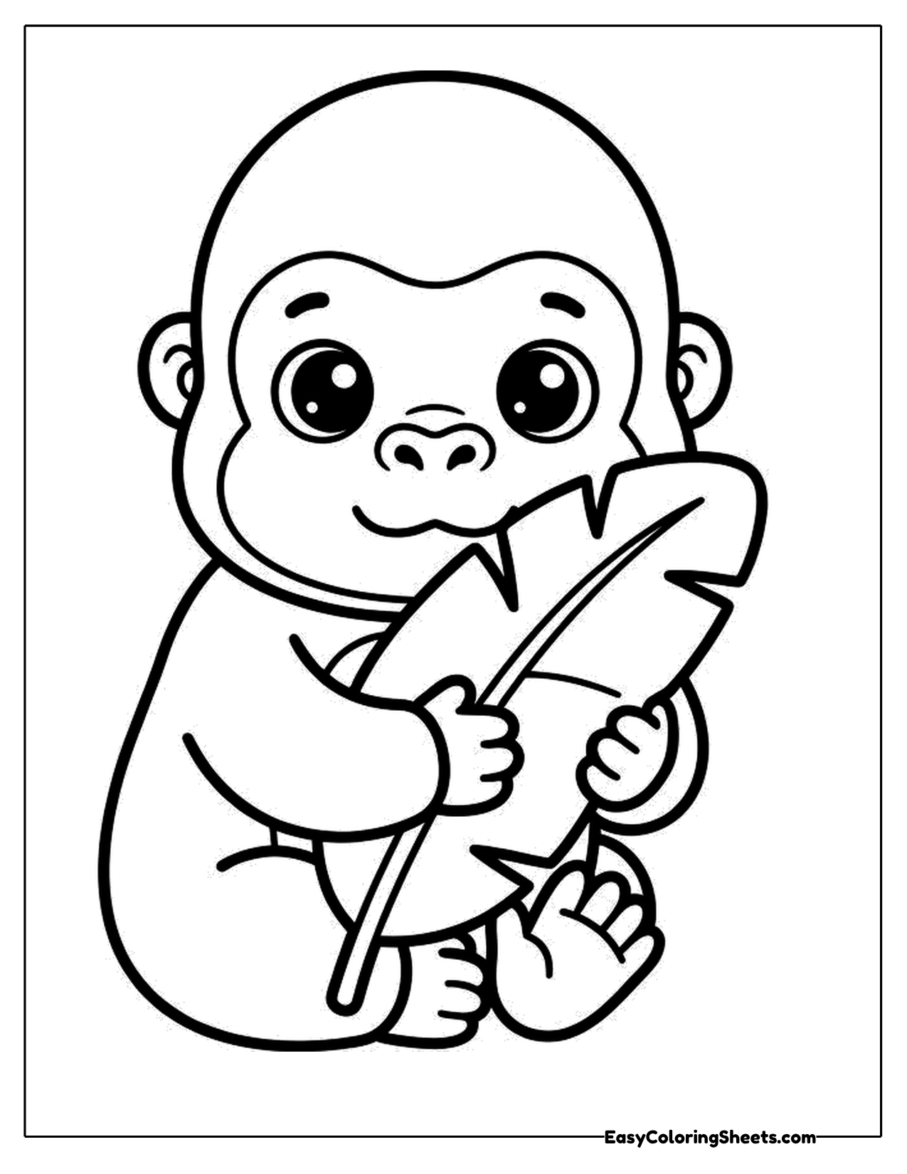 Cute young gorilla holding a big leaf