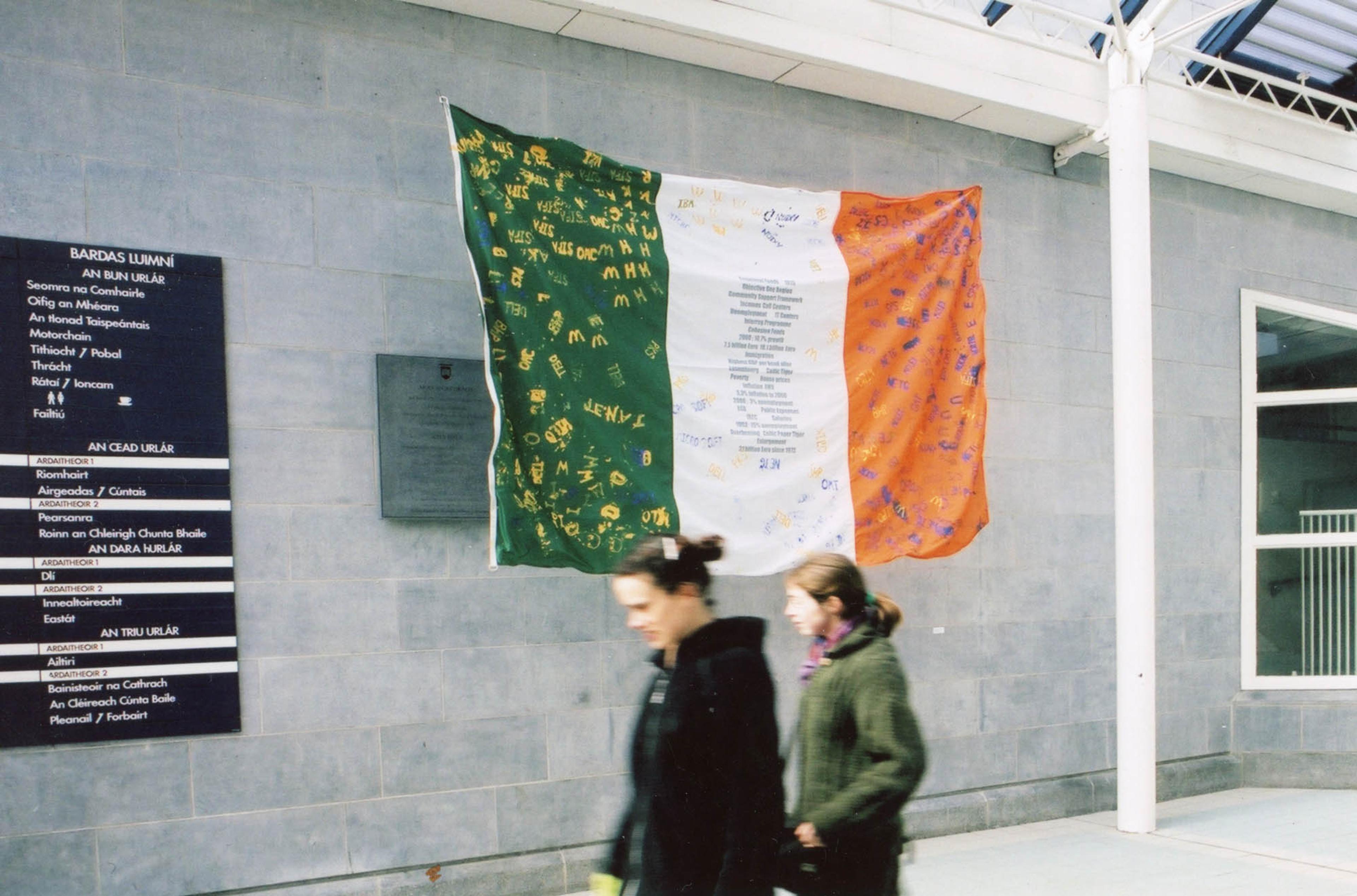 (2001) Jota Castro and Carmela Uranga, Starching the Flag, 2001, public printing event, Irish flag, potato-cuts, coloured ink and starch. 