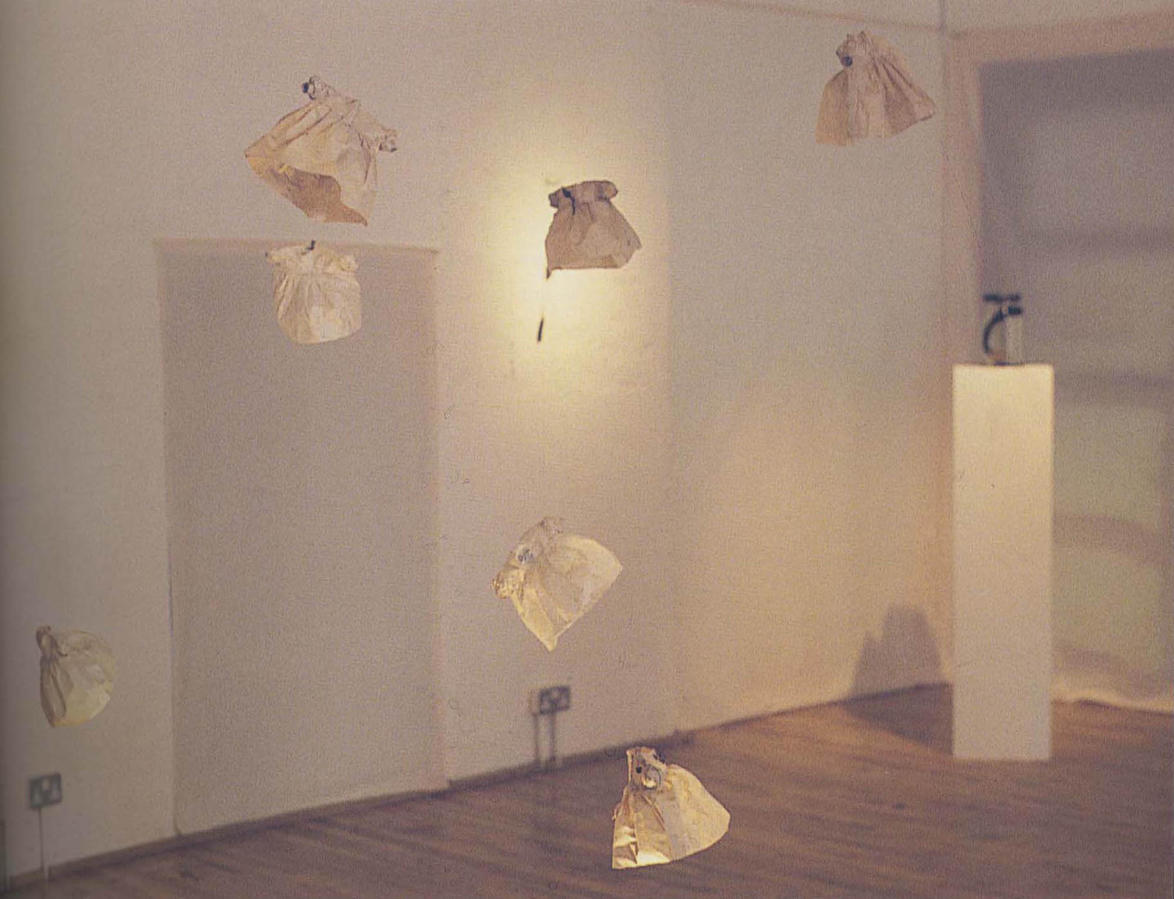 (2001) Jean Conroy, Angel, Little Dresses, 2000, bronze, mixed media installation, 29.9 x 5 cm.
