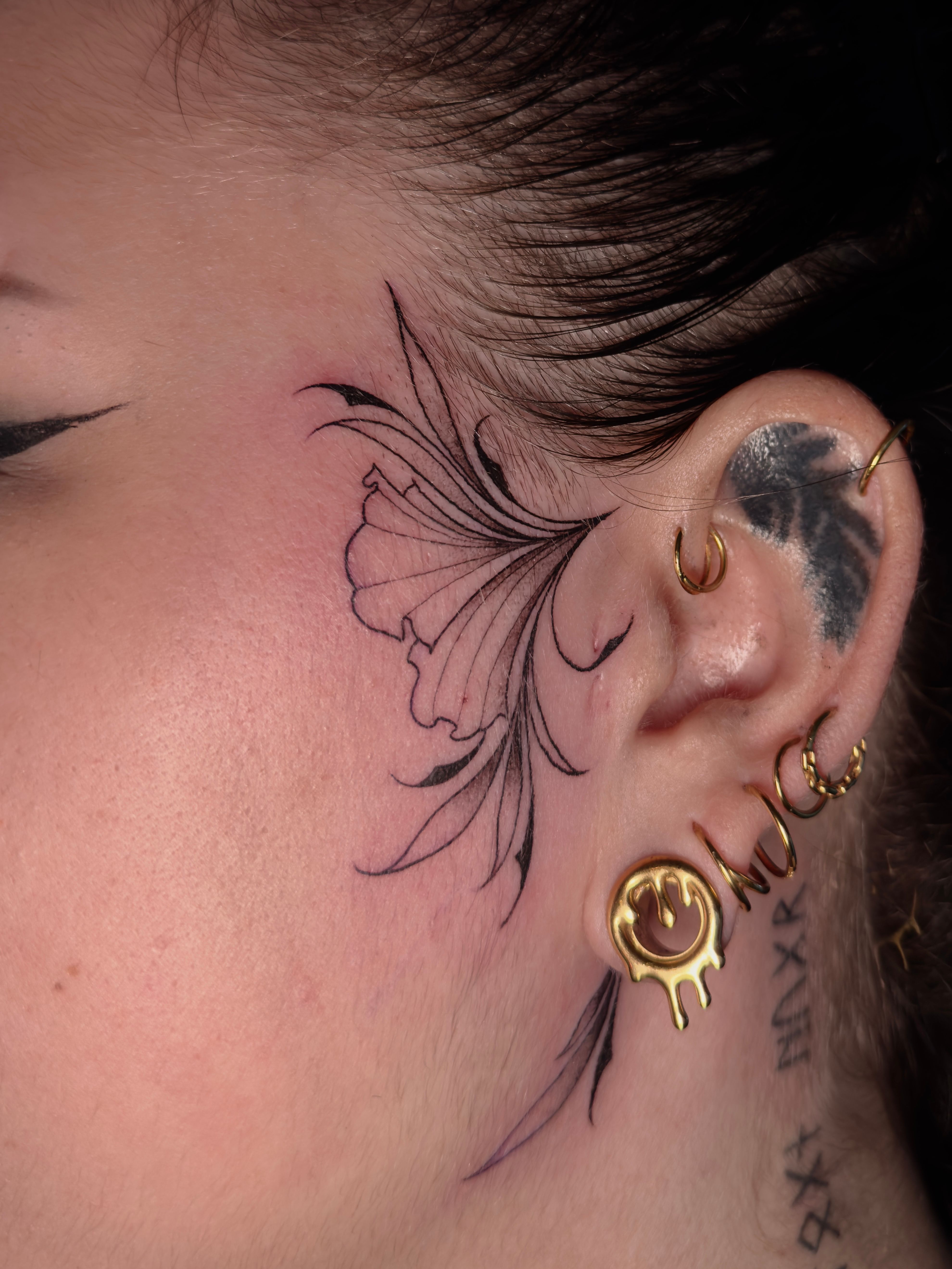 Fineline face tattoo