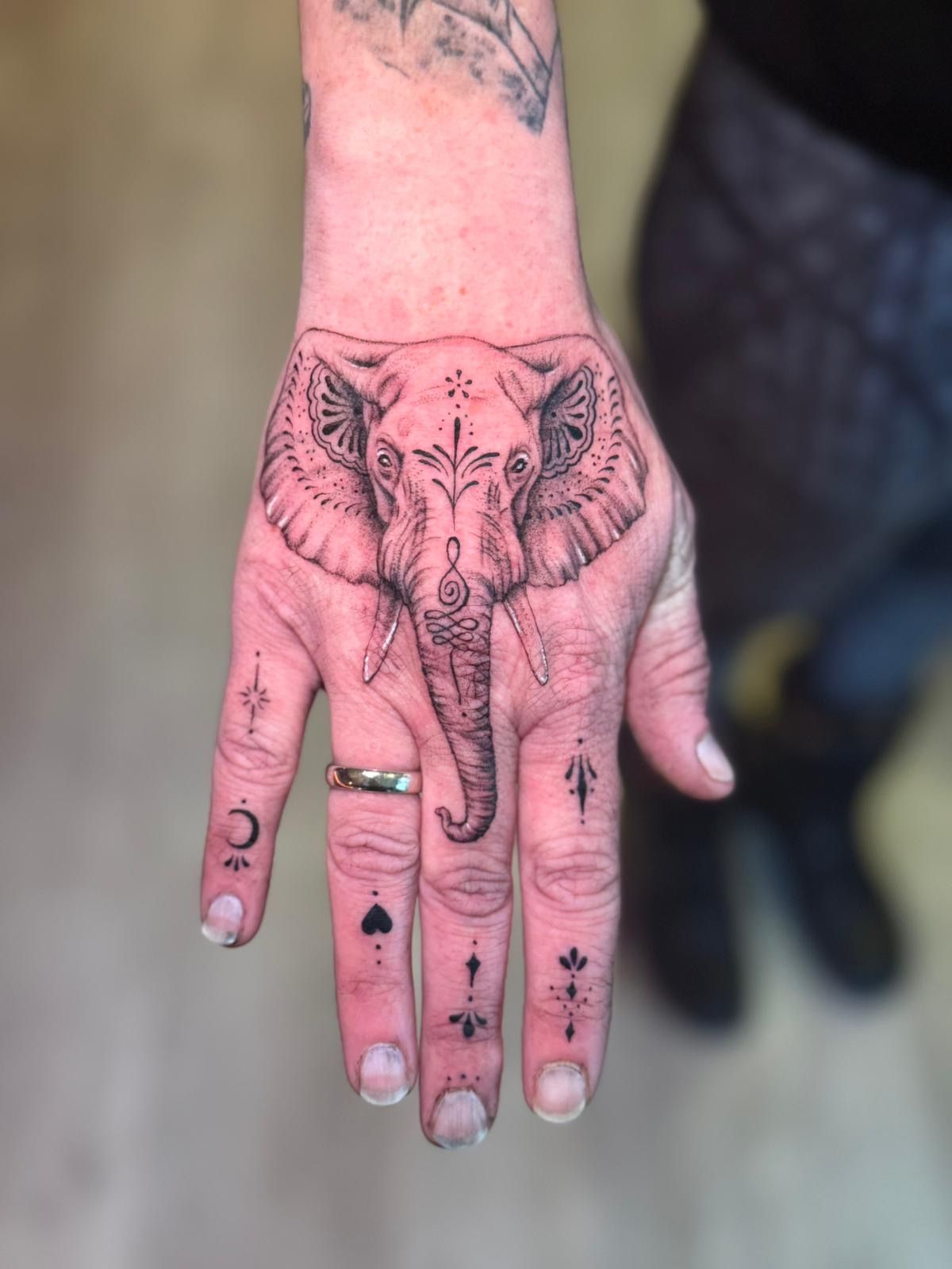 Elephant hand tattoo