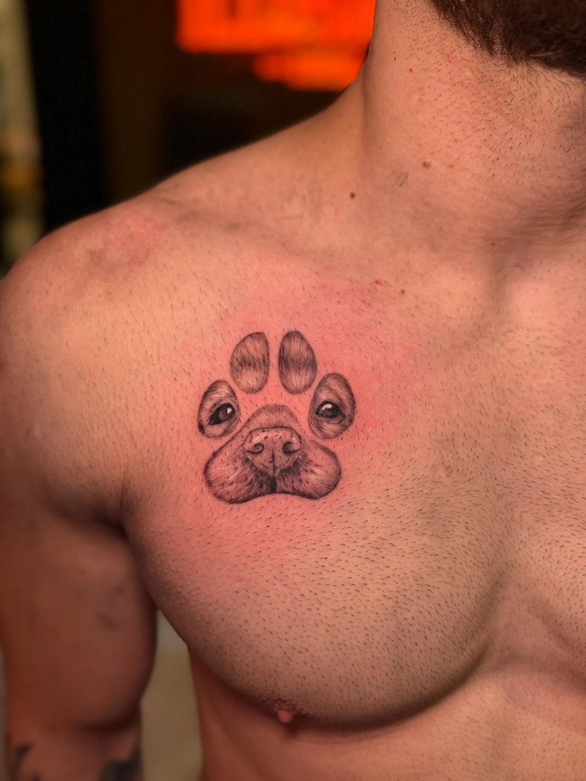Dog portrait in paw print