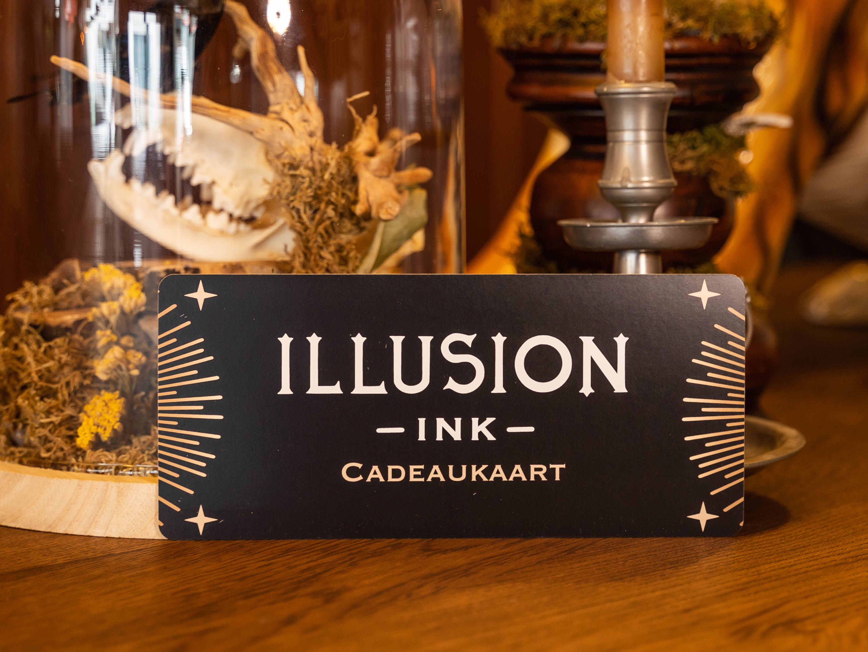 Een cadeaubon voor een tattoo bij Illusion Ink.