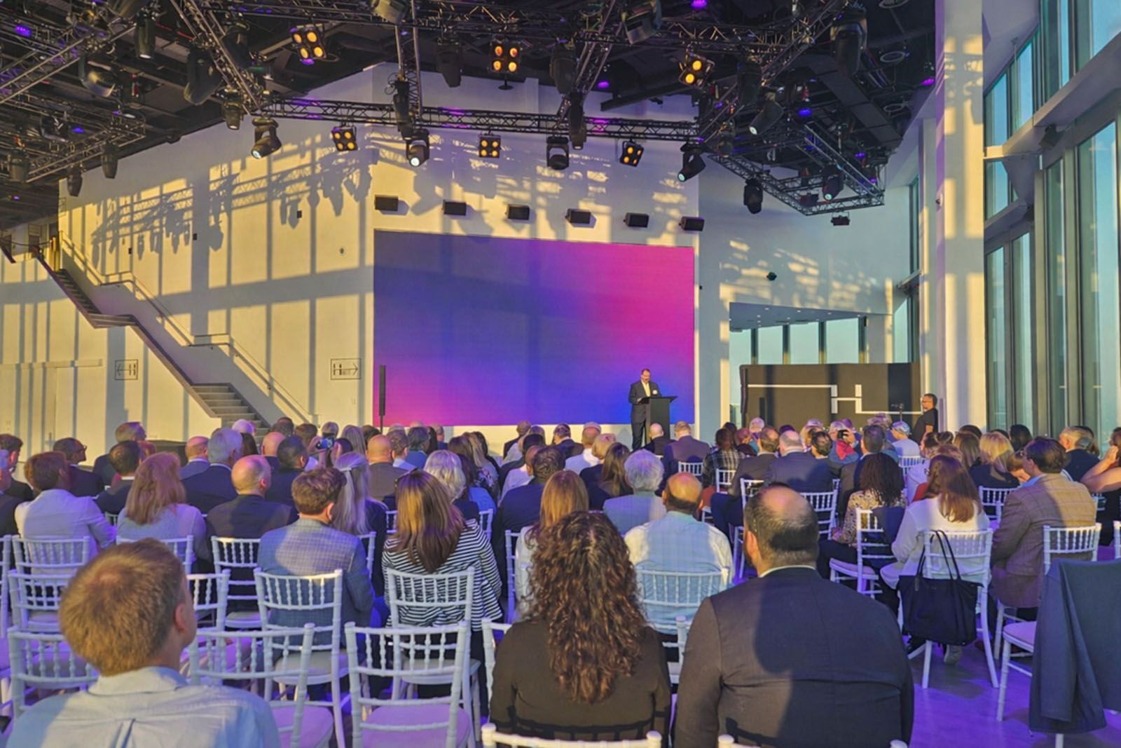 Attendees talking while taking in the views