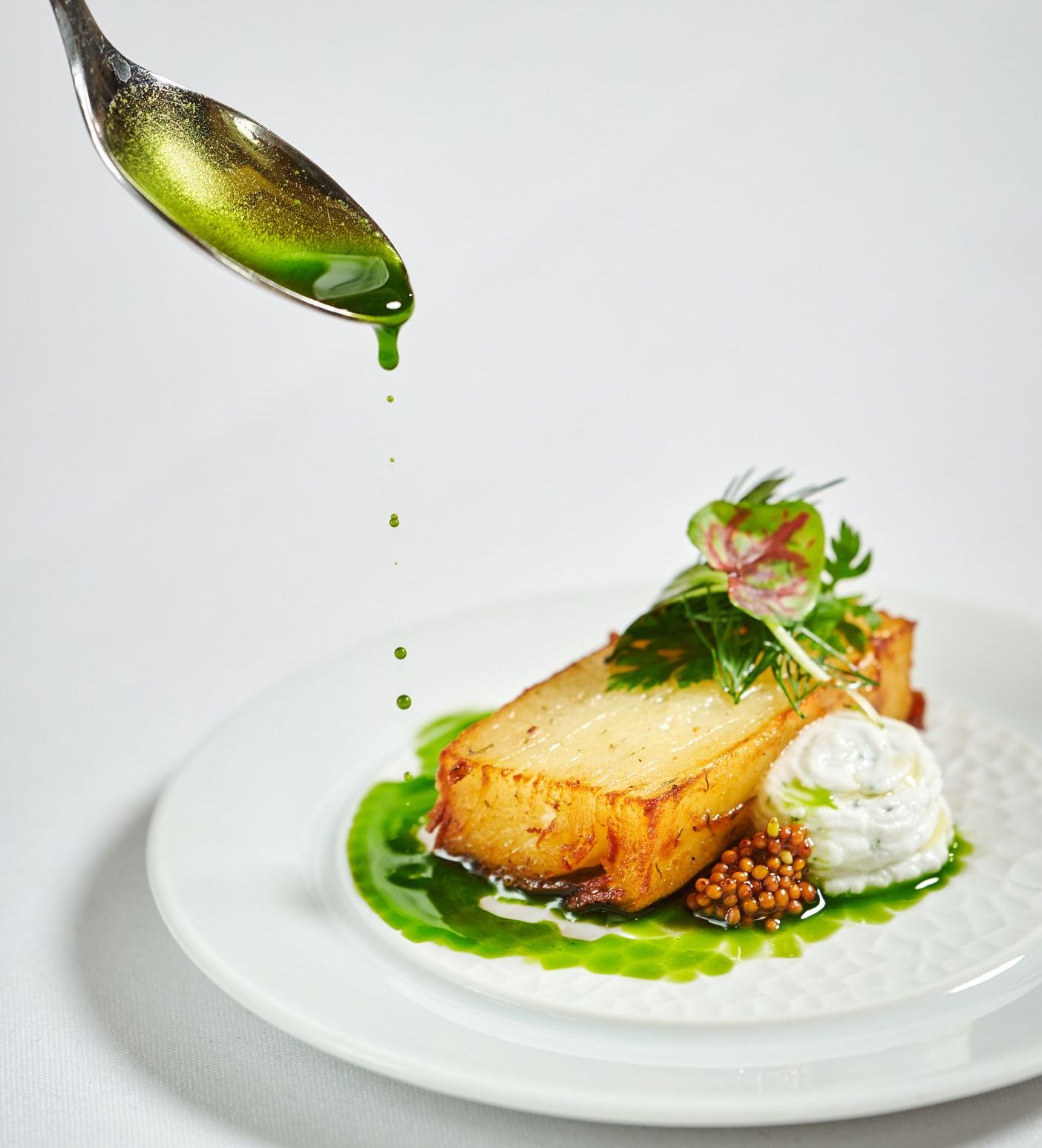 Drizzling sauce on dish