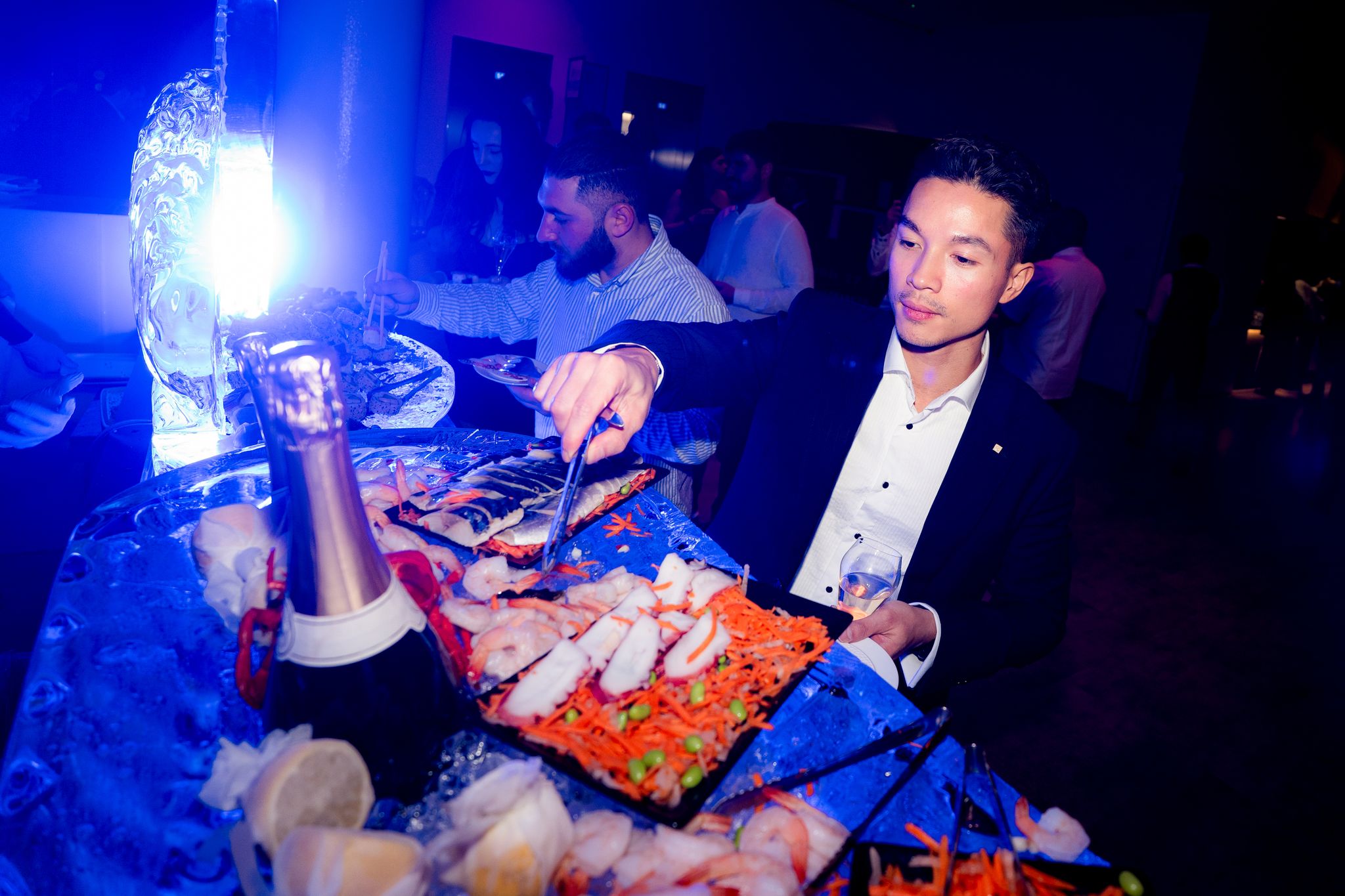Man grabbing food at a buffet